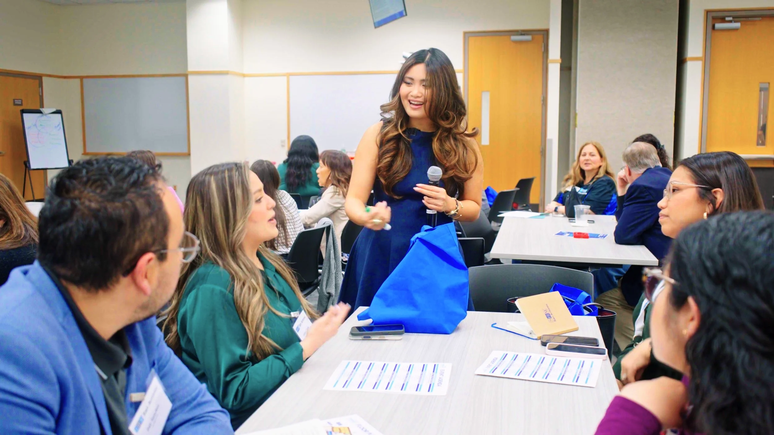 Lyka Ferry coaching a group of professionals