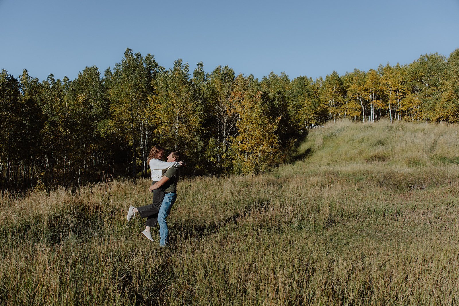 Photograph of a couple for their engagement photos up Spanish Fork canyon in the fall