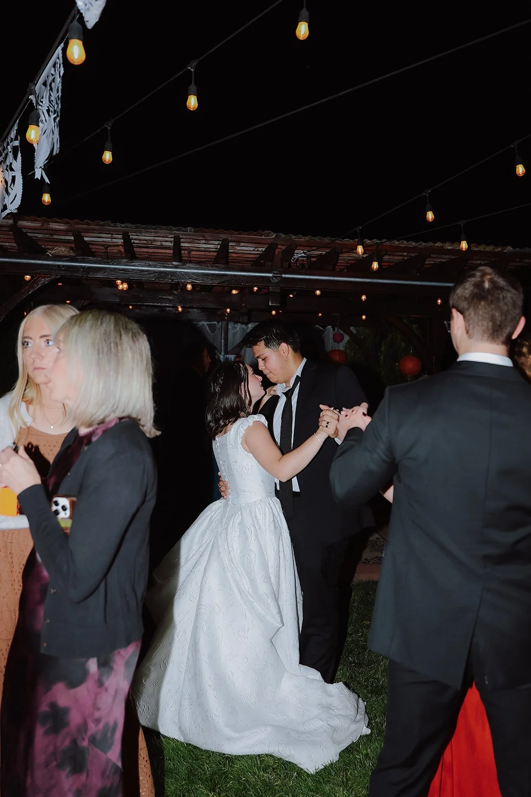 Photograph of a bride and a groom on the wedding dance floor