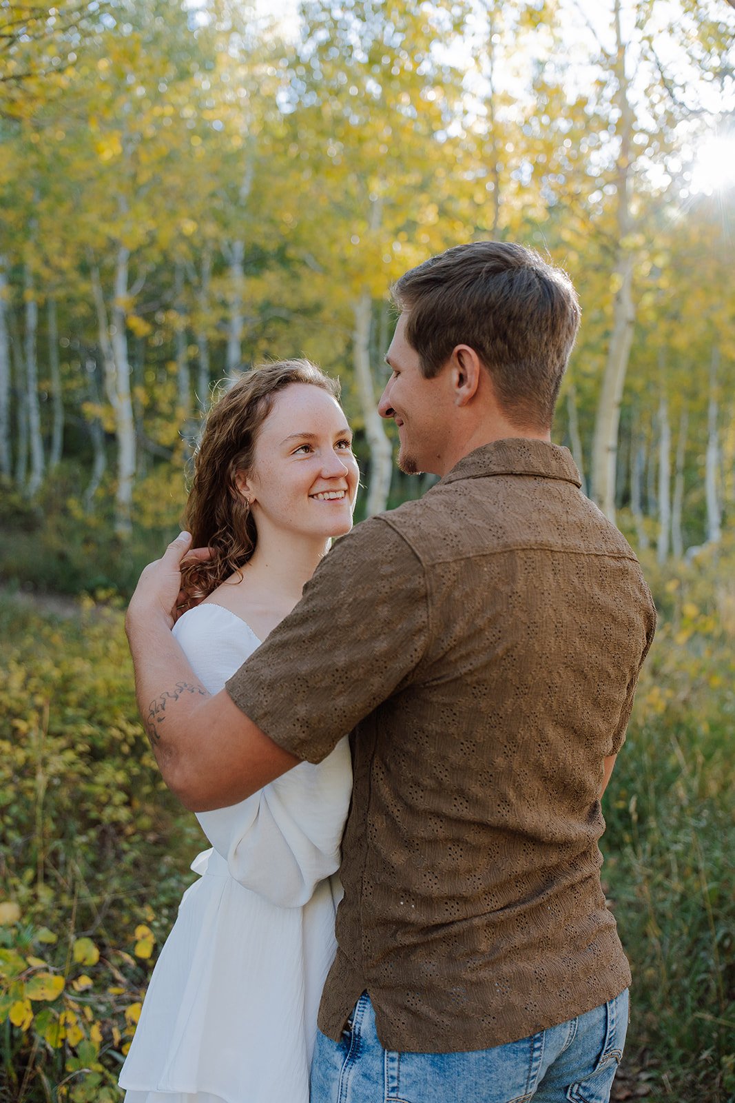 Photograph of a couple for their engagement photos up Spanish Fork canyon in the fall