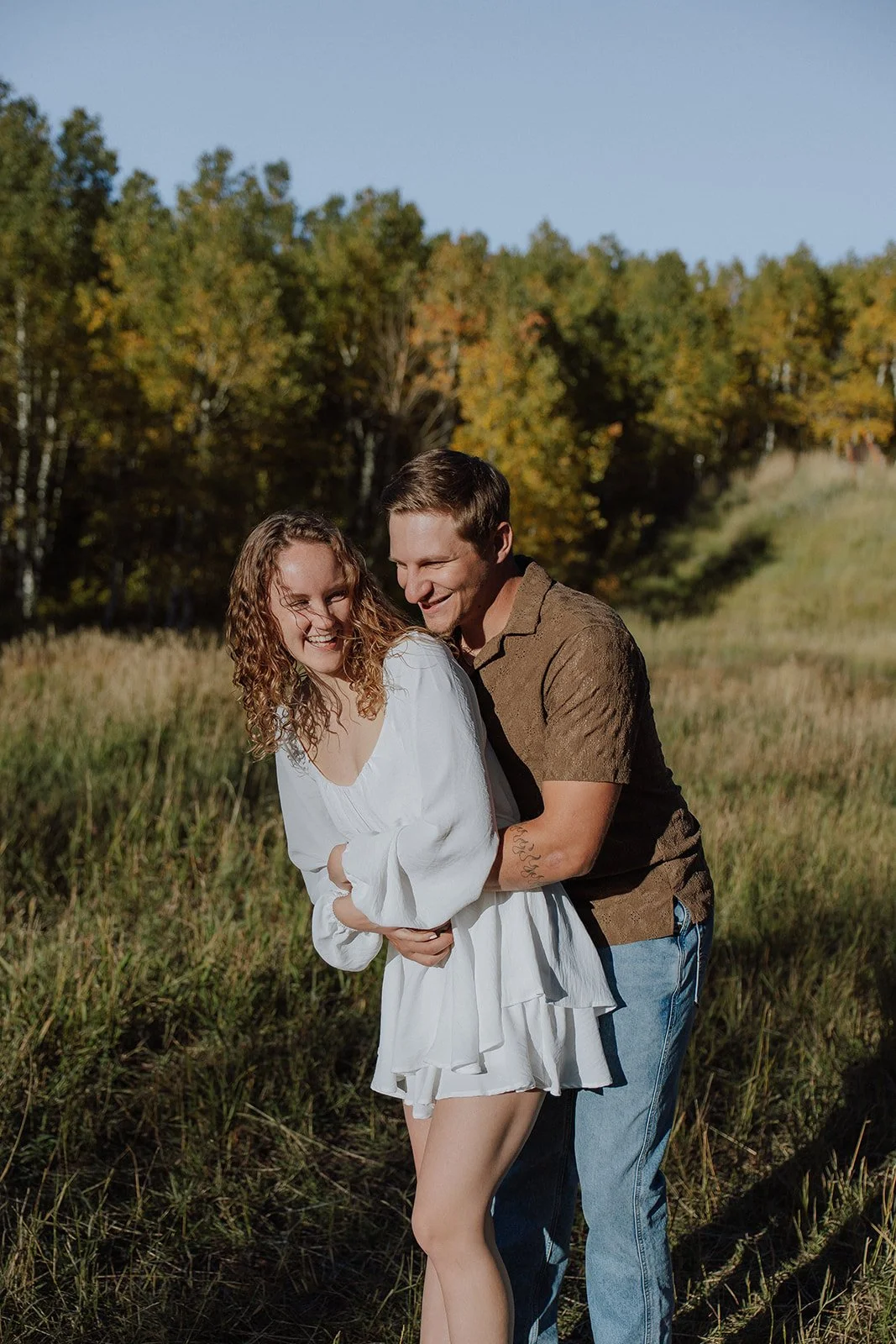 Photograph of a couple for their engagement photos up Spanish Fork canyon in the fall
