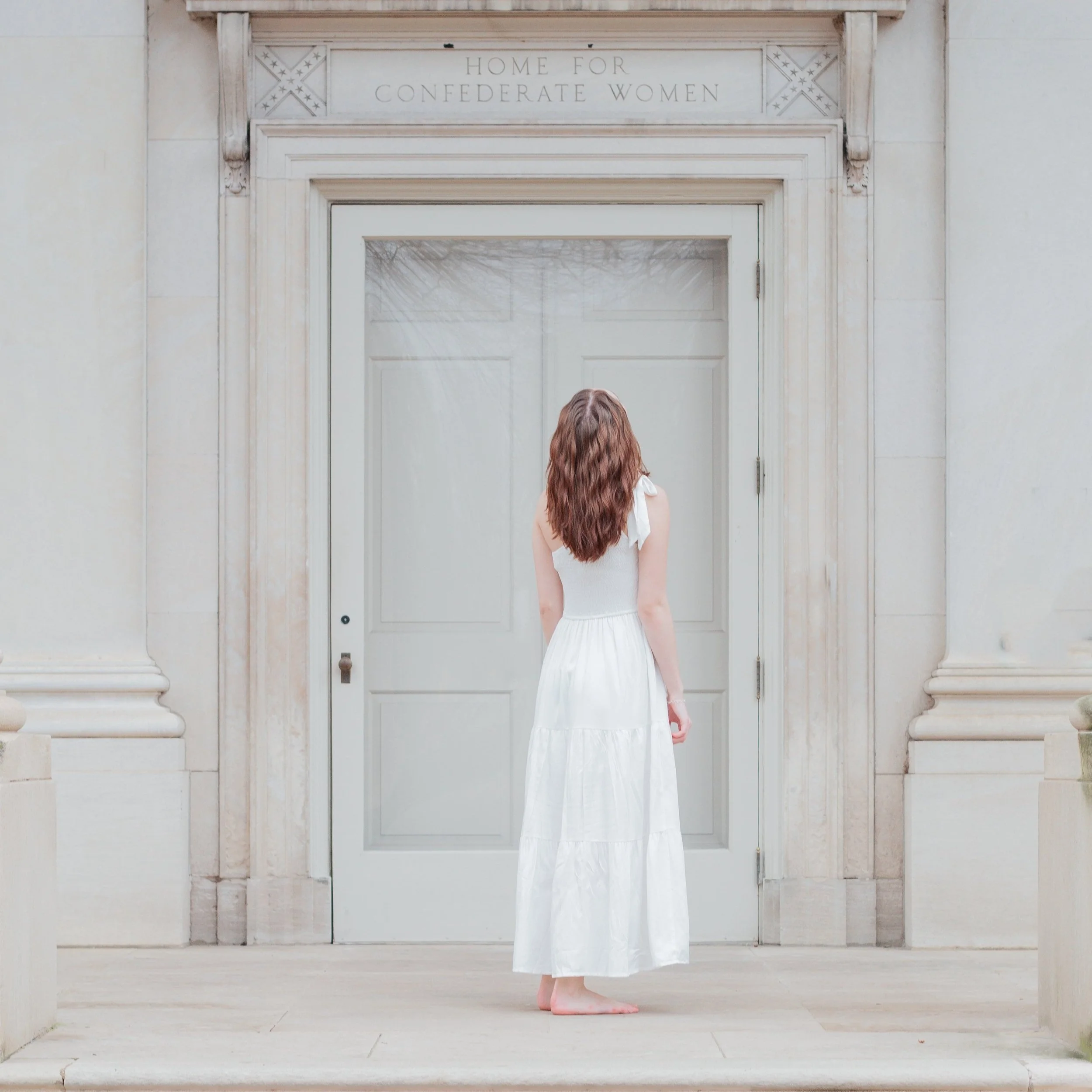 places-to-get-married-in-virginia-bridal-bride-and-groom-white-dress-with-red-hair-blue-and-white-door