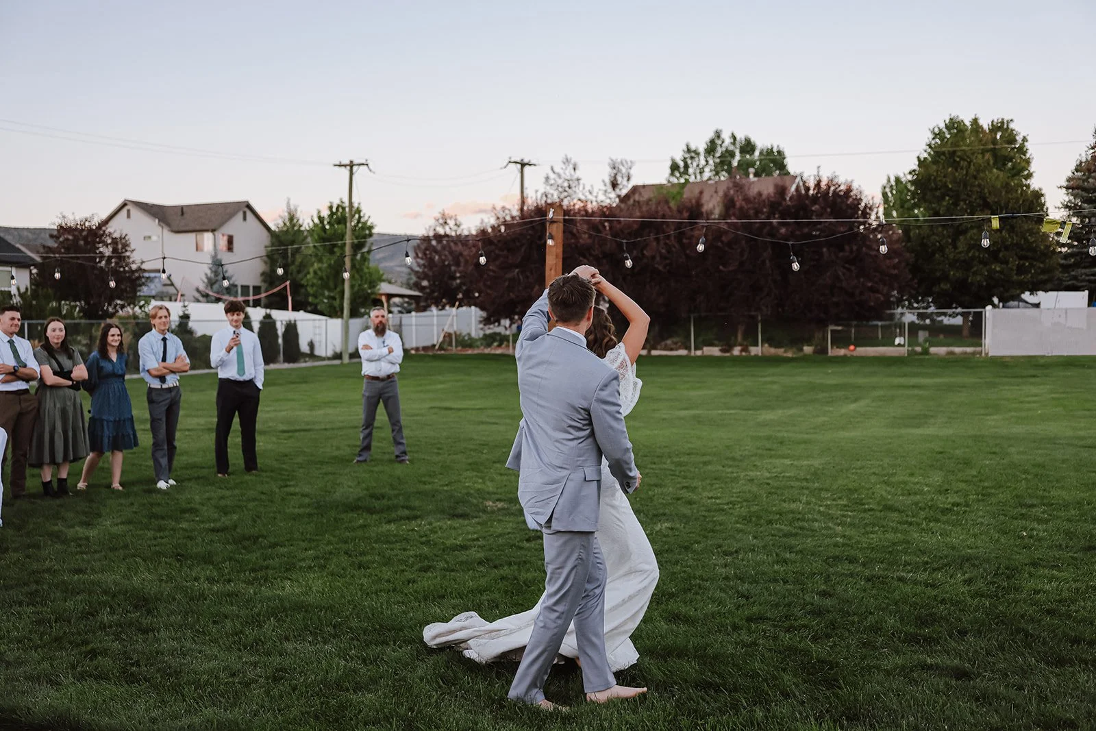 Photograph of a bride and groom's first dance outside at Heber City