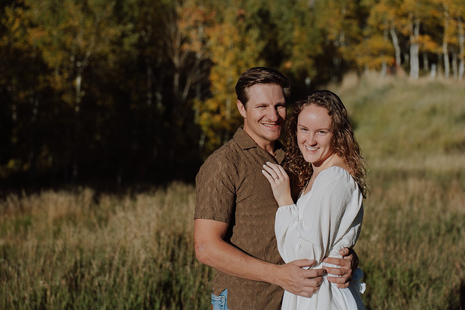 Photograph of a couple for their engagement photos up Spanish Fork canyon in the fall