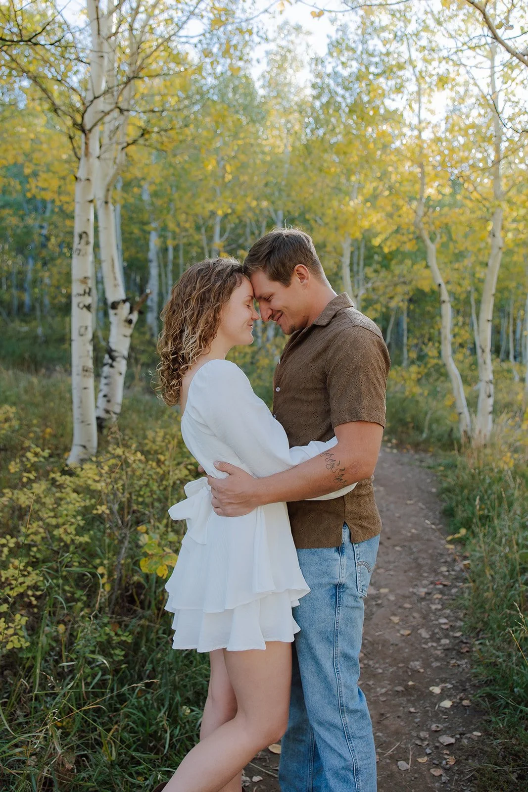 Photograph of a couple for their engagement photos up Spanish Fork canyon in the fall