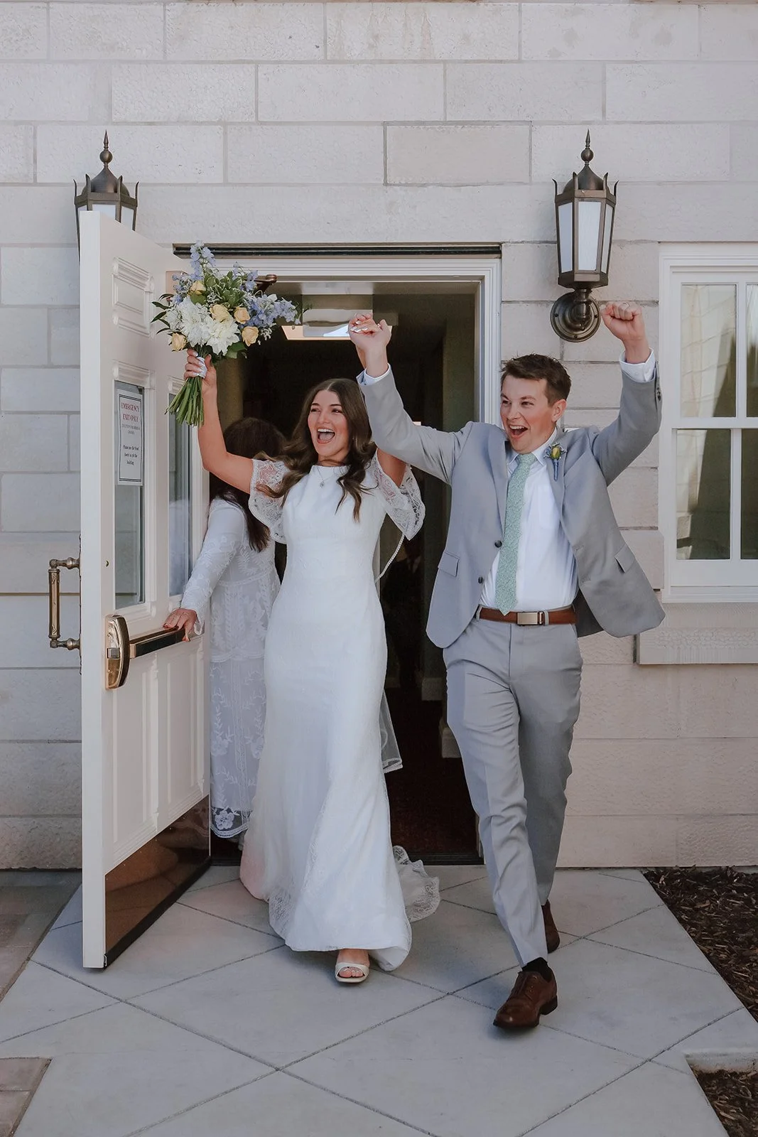 Photograph of a bride and groom exiting the Manti Utah Temple