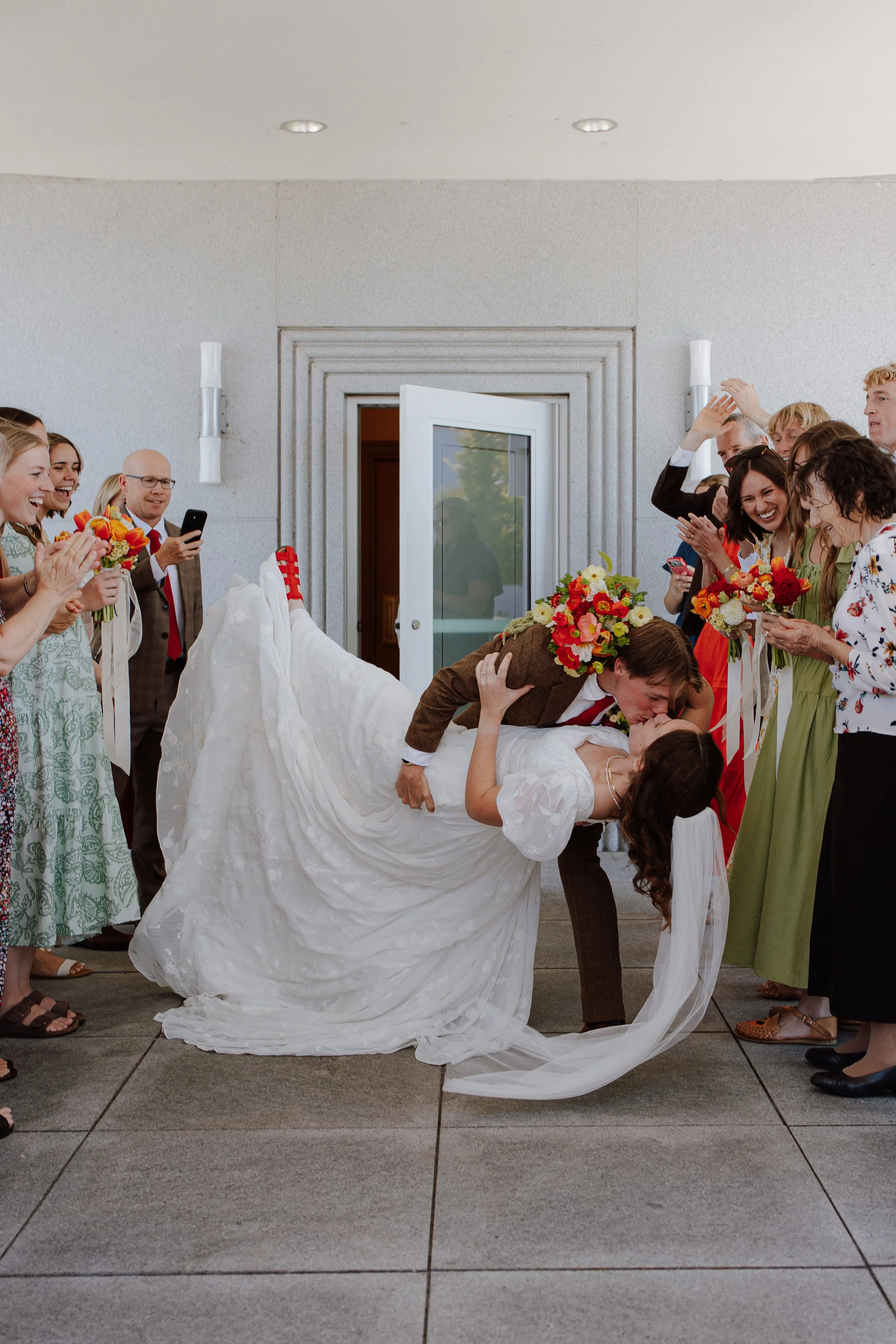 California Oakland temple LDS wedding photographer bride and groom bright florals red color theme