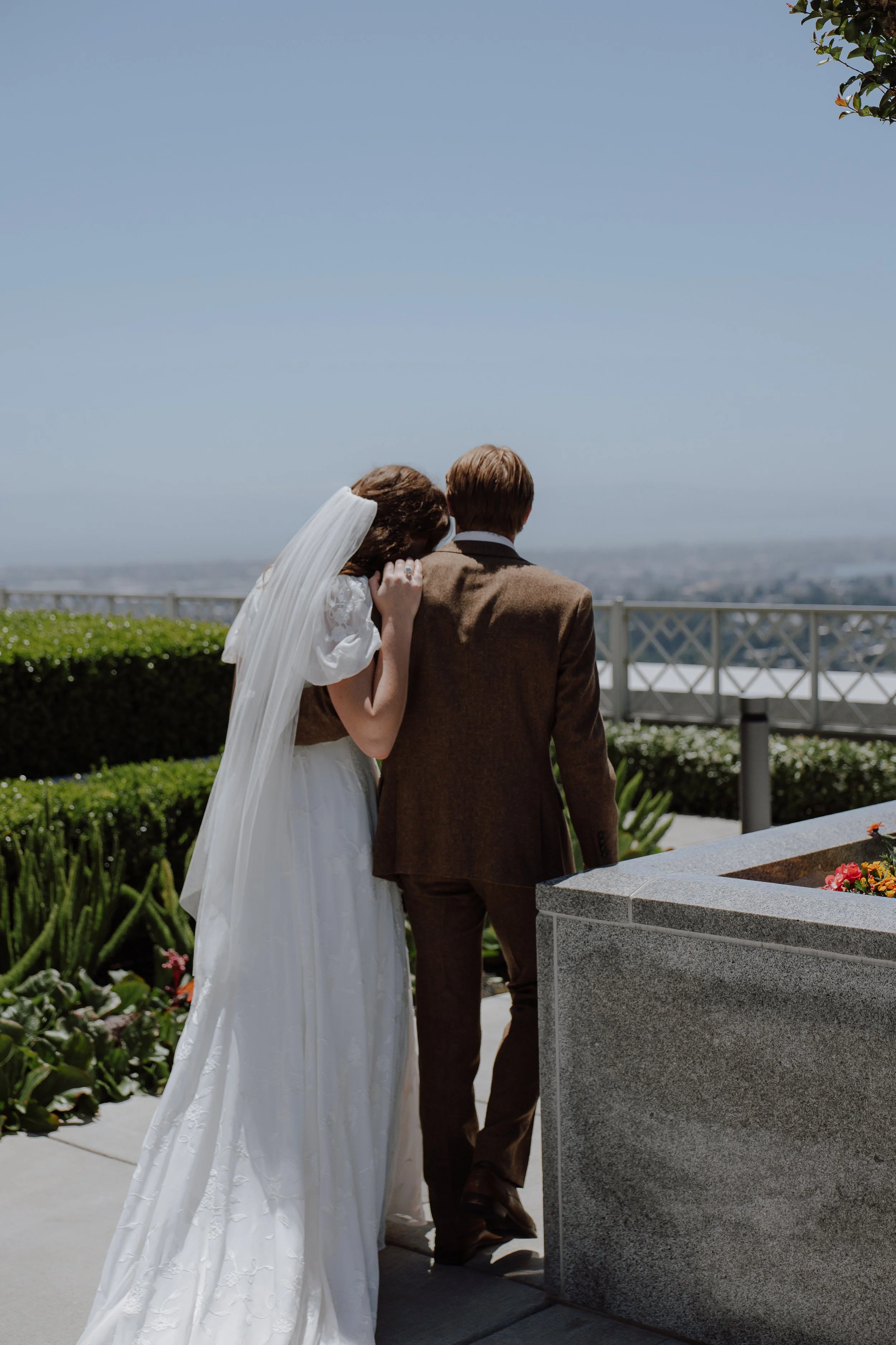 California Oakland temple LDS wedding photographer bride and groom bright florals red color theme Santa Rosa backyard wedding reception