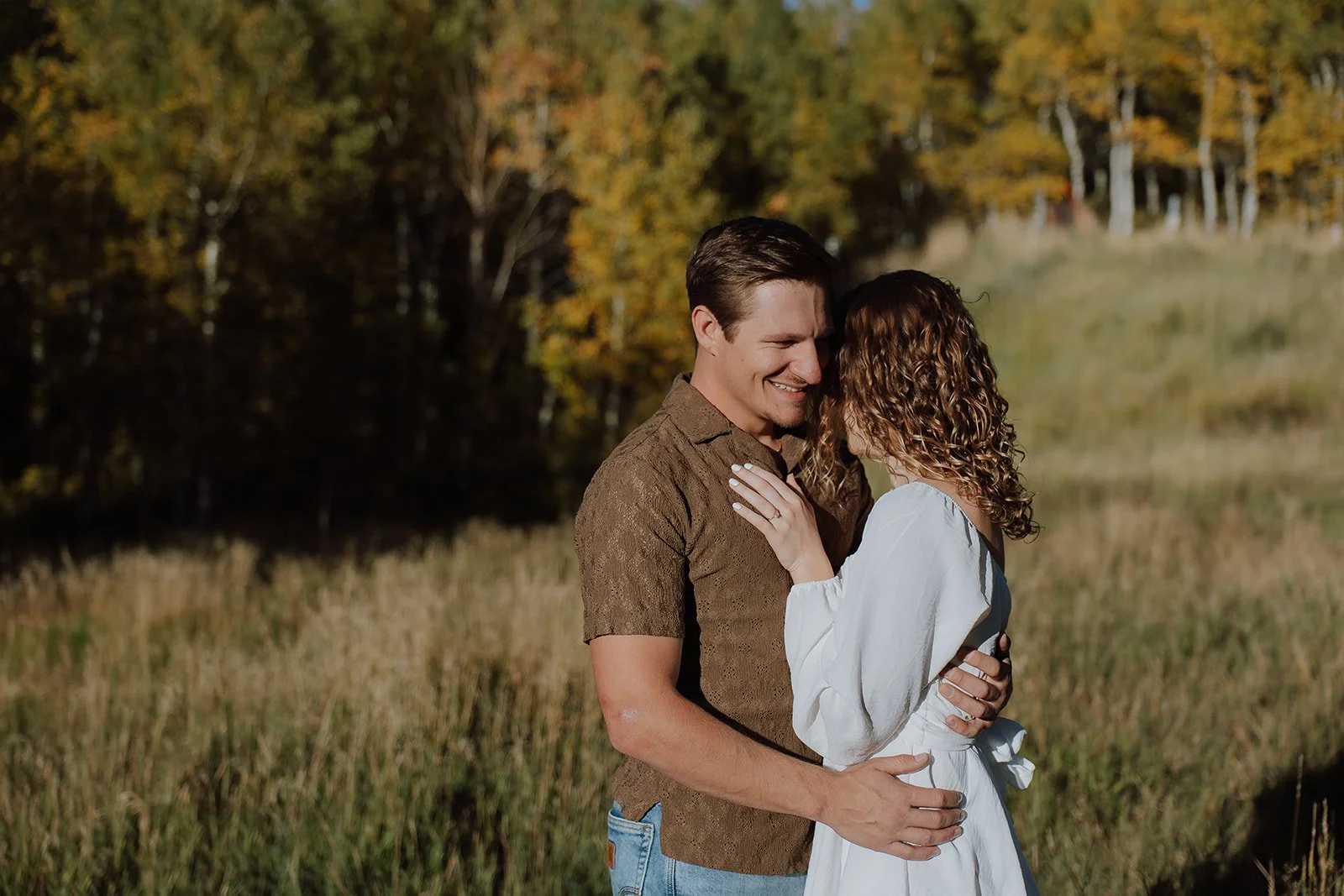Photograph of a couple for their engagement photos up Spanish Fork canyon in the fall