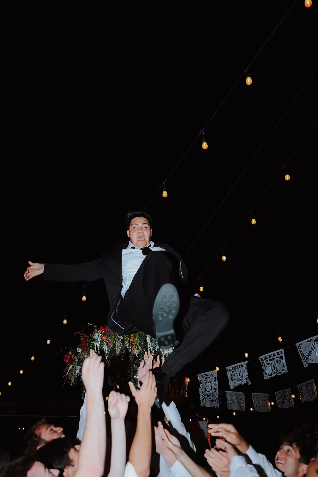 Photograph of a bride and a groom on the wedding dance floor