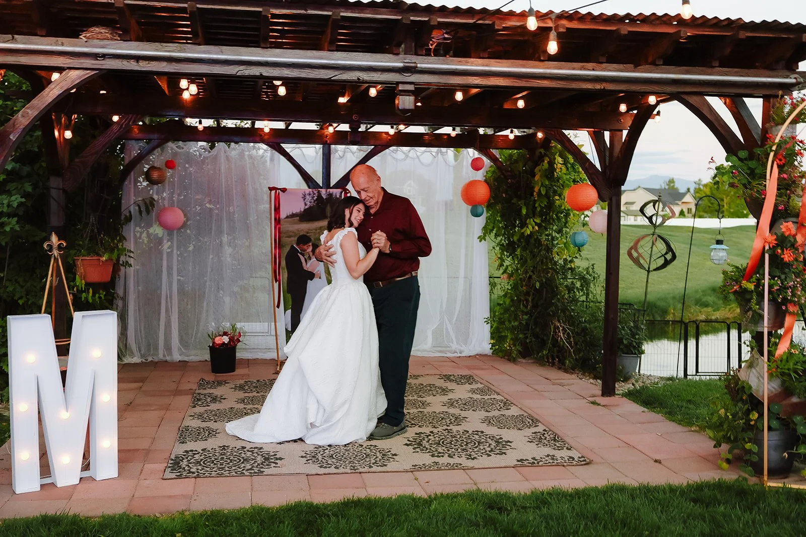 Photograph of a bride with her father at an LDS wedding reception in Syracuse, Utah