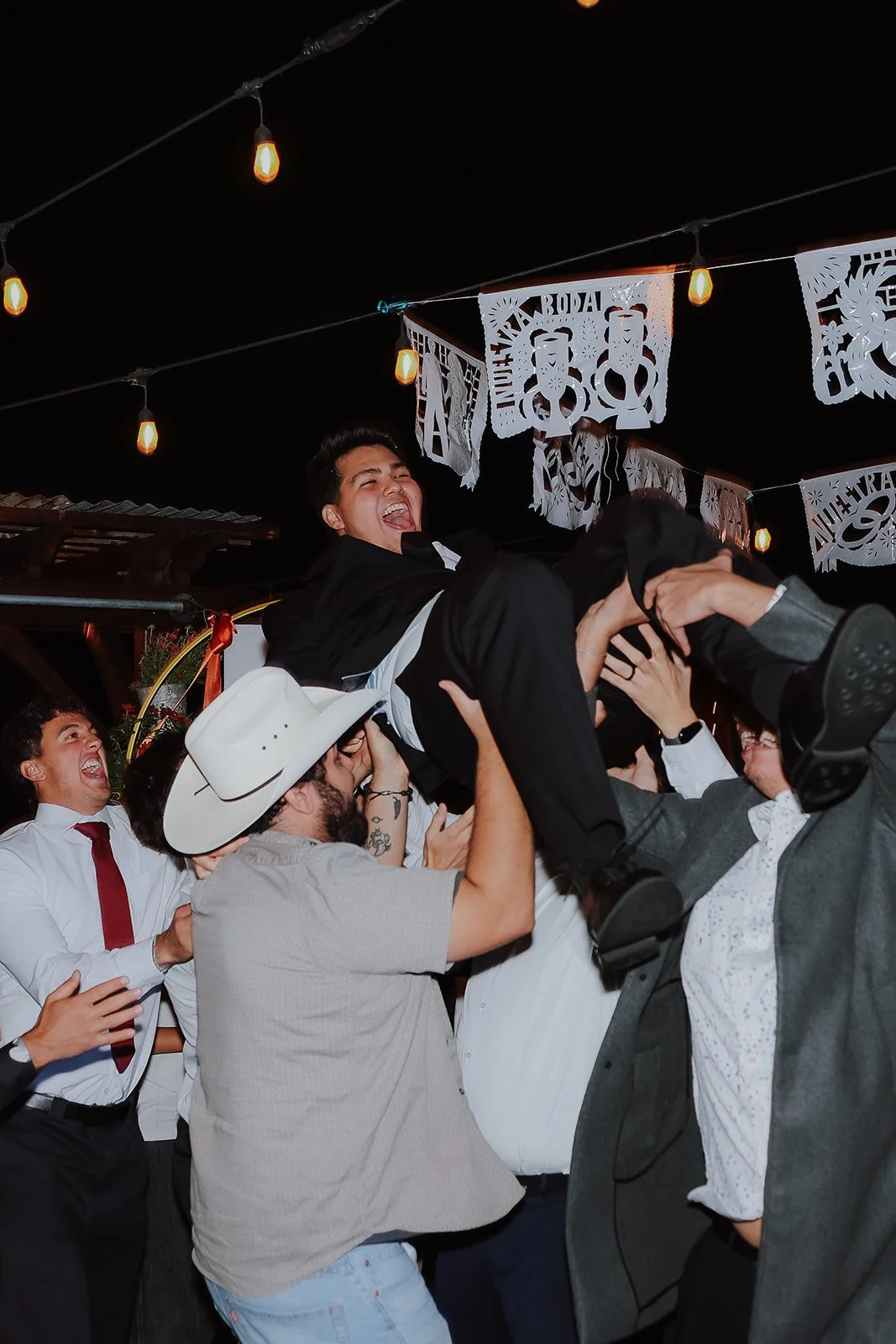 Photograph of a bride and a groom on the wedding dance floor