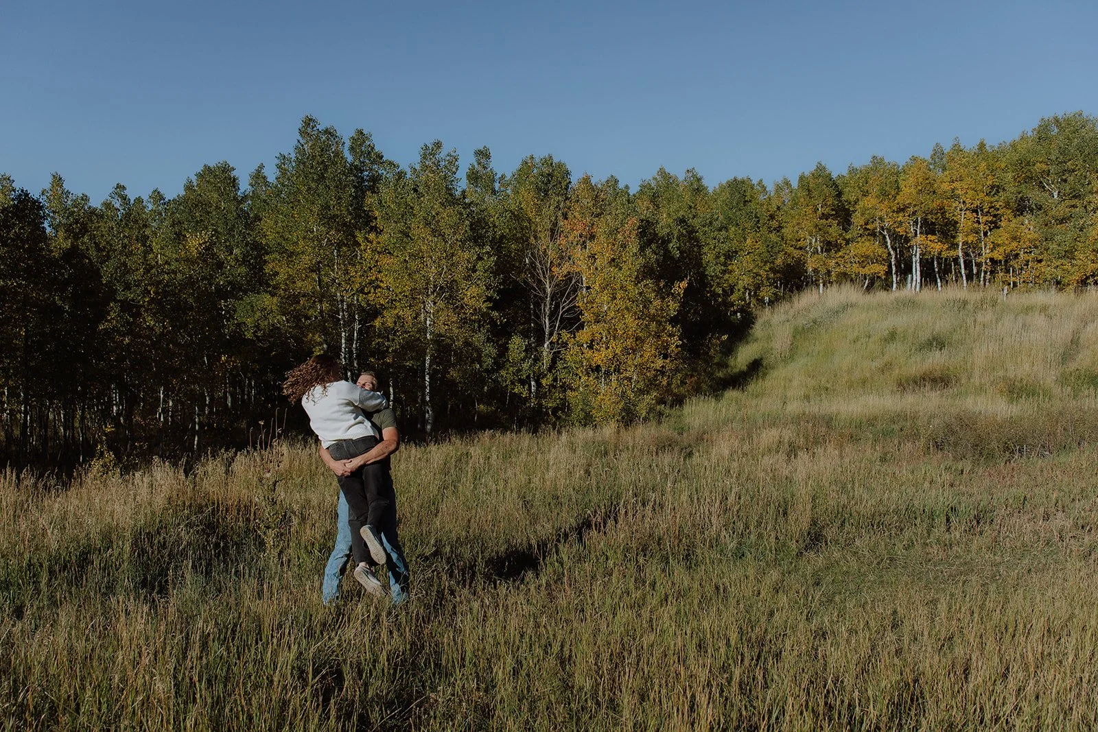Photograph of a couple for their engagement photos up Spanish Fork canyon in the fall