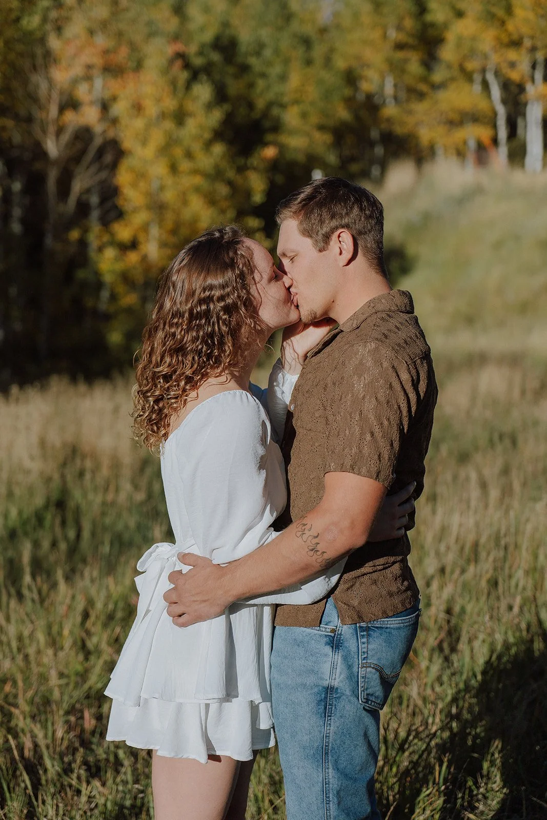 Photograph of a couple for their engagement photos up Spanish Fork canyon in the fall