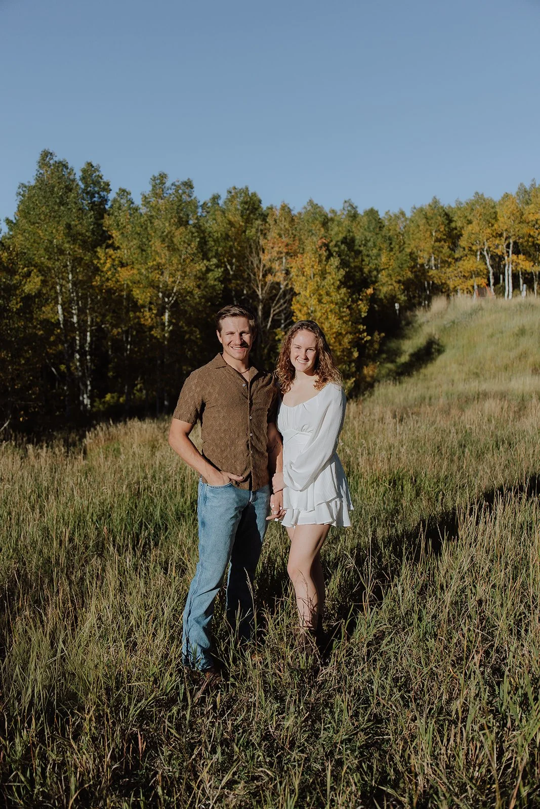 Photograph of a couple for their engagement photos up Spanish Fork canyon in the fall