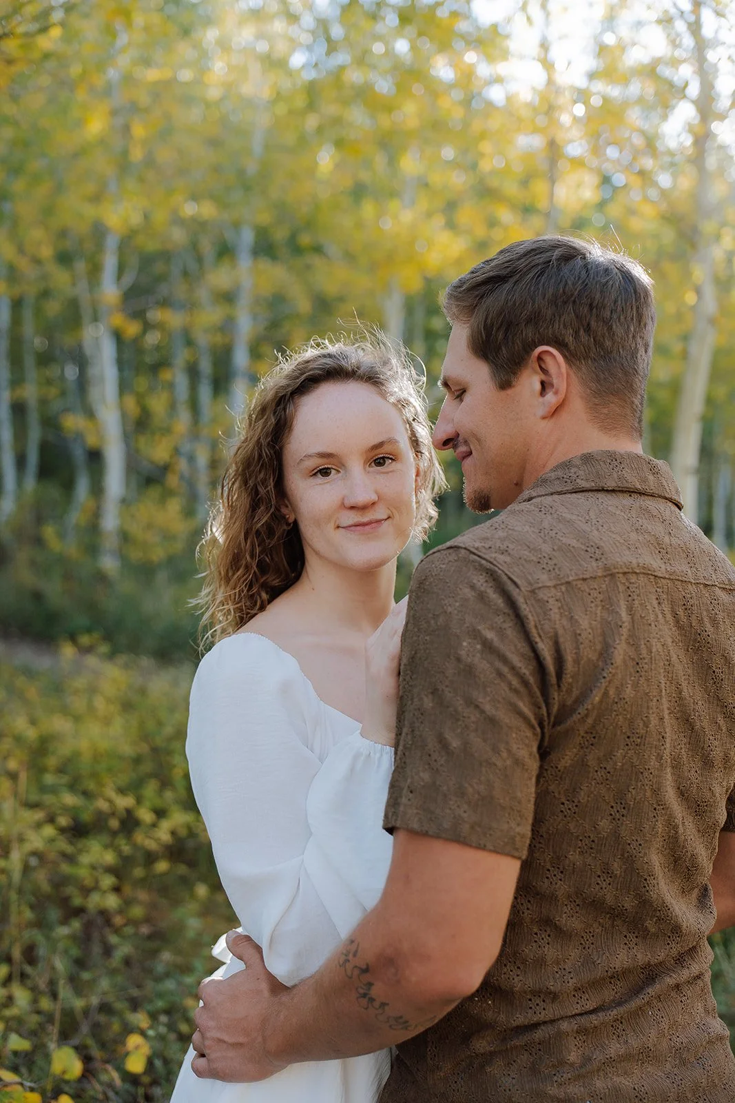 Photograph of a couple for their engagement photos up Spanish Fork canyon in the fall