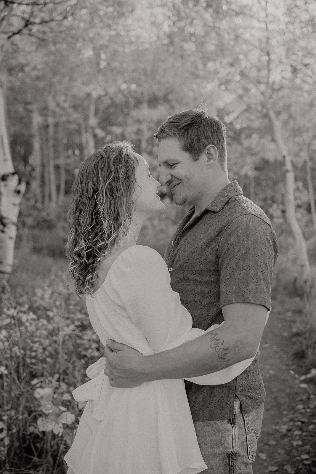 Photograph of a couple for their engagement photos up Spanish Fork canyon in the fall
