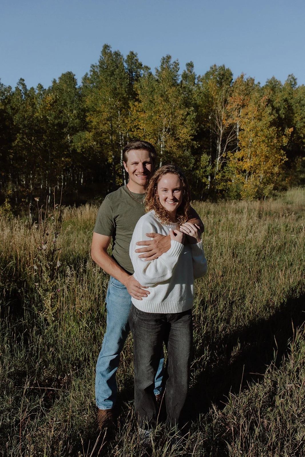 Photograph of a couple for their engagement photos up Spanish Fork canyon in the fall