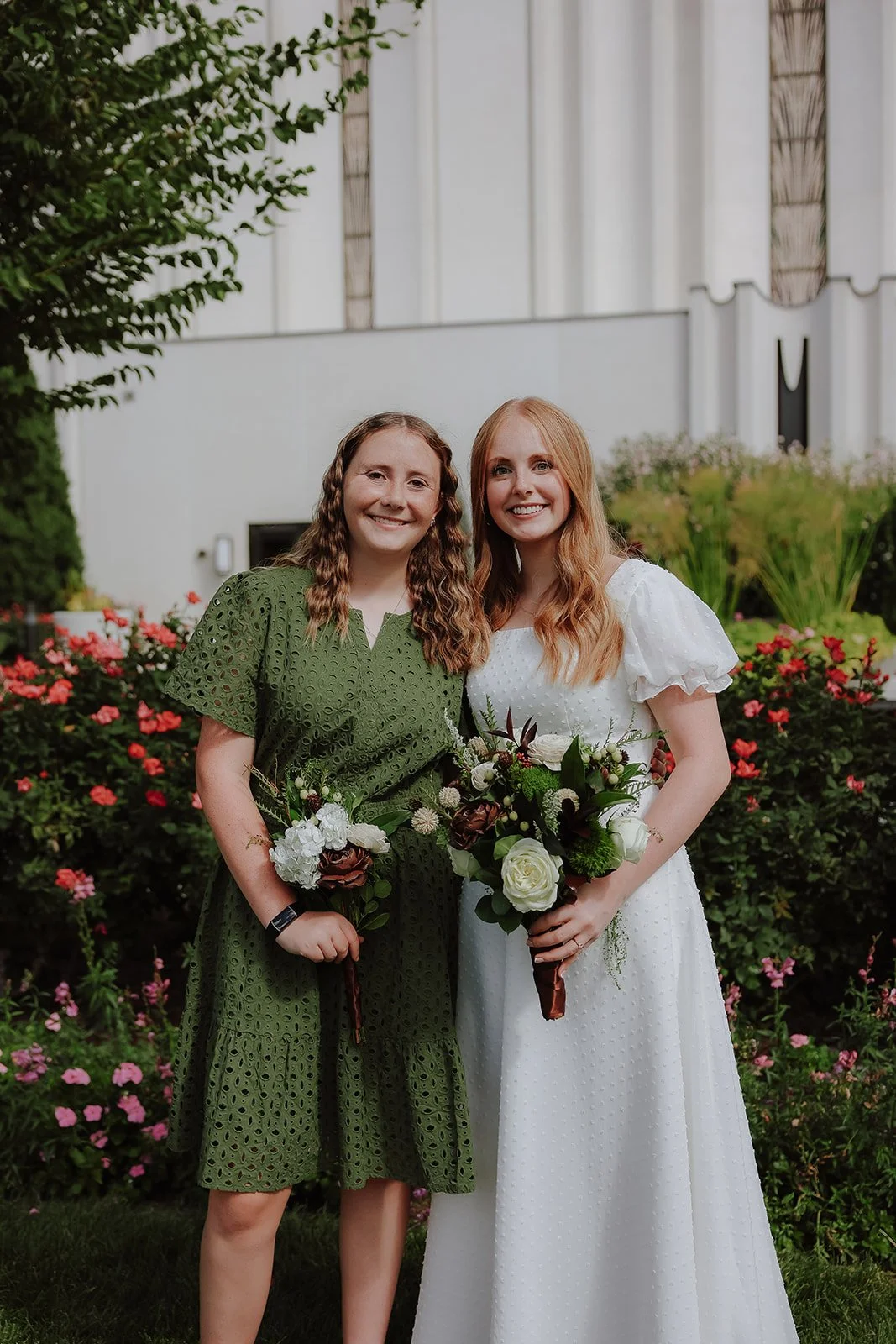 Bride with bridesmaid in green dress at the jordan river temple