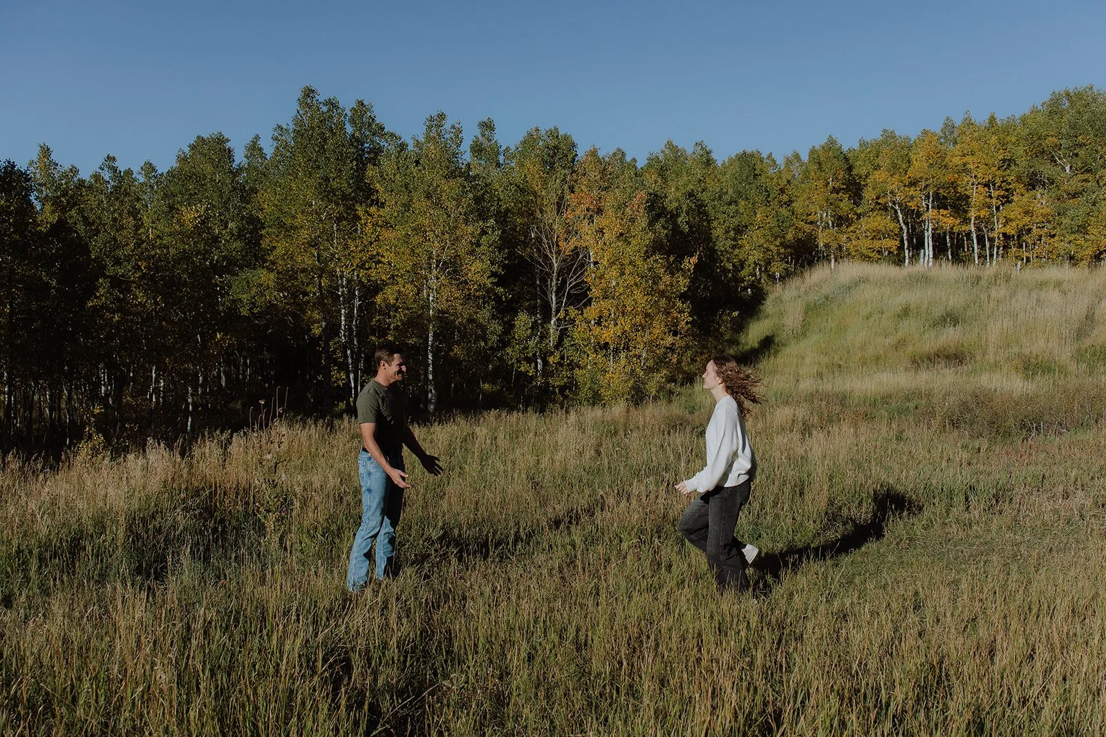 Photograph of a couple for their engagement photos up Spanish Fork canyon in the fall