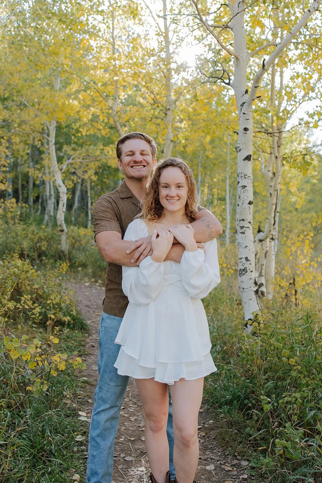 Photograph of a couple for their engagement photos up Spanish Fork canyon in the fall