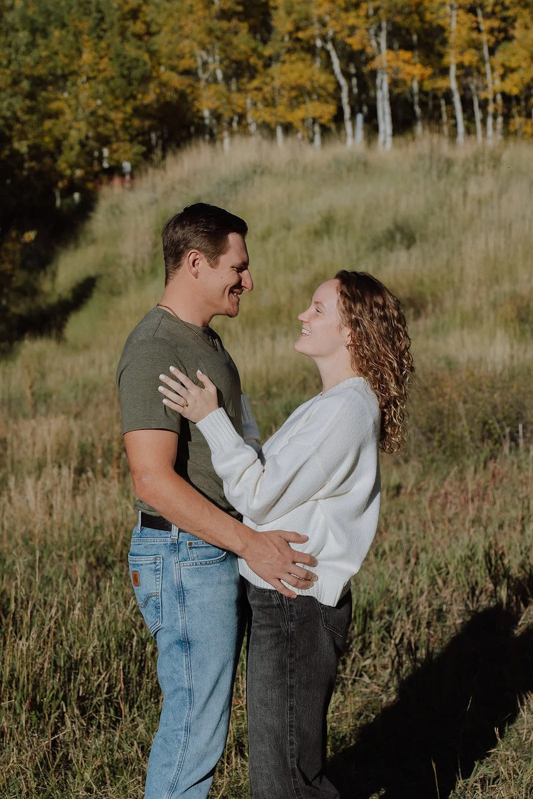Photograph of a couple for their engagement photos up Spanish Fork canyon in the fall