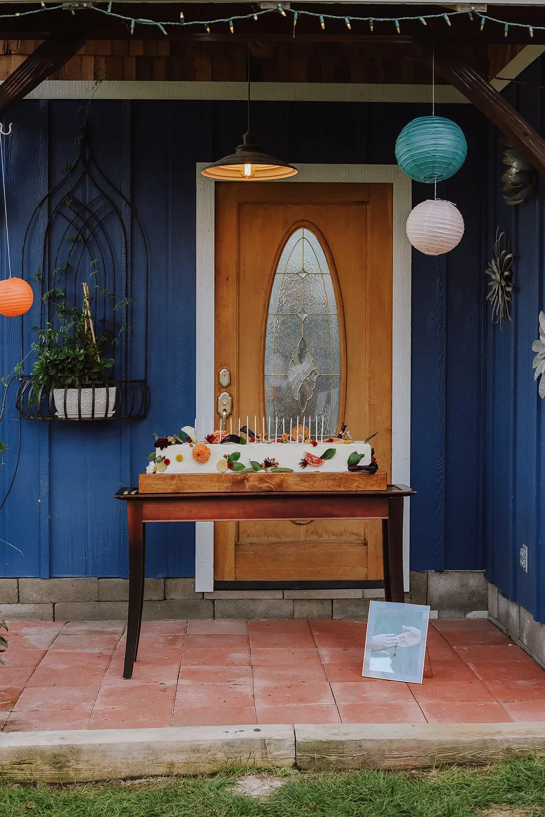 Photograph of a backyard wedding reception cake stand