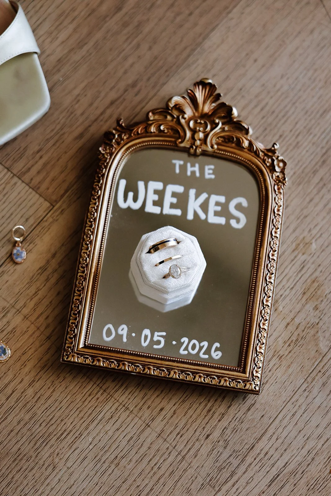 Photograph of wedding details mirror with name and date