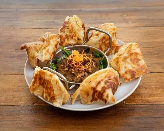 Something different in Port Mac? 👀
Come get your hands on our hot-selling Roti Rendang 🔥
Flaky, crispy roti + slow-cooked beef in spiced coconut sauce = flavour party in every bite 🥩🥥✨ 
Trust us… one bite and you’ll be hooked 😍
Ava