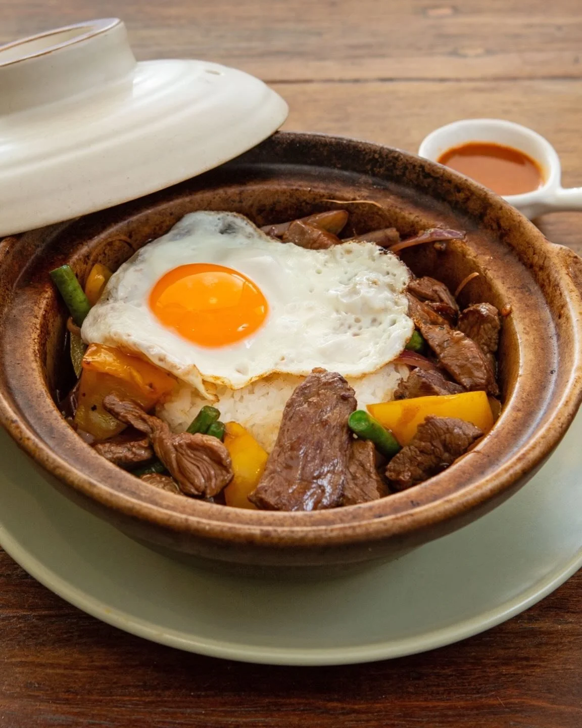 Sliced Beef Peppered Claypot&mdash;bold heat, tender beef, sizzling rice. A Bloom favourite for a reason. 🔥🍳