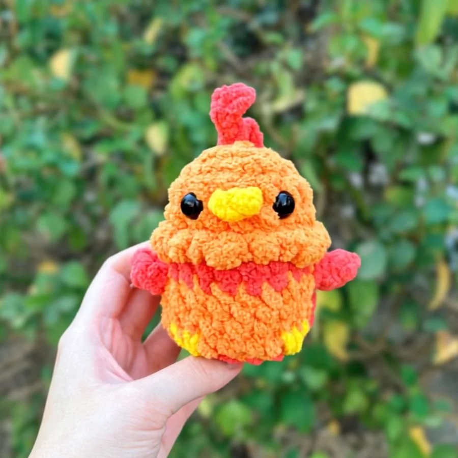 front view of no-sew little crochet phoenix held with a hand - free phoenix crochet pattern