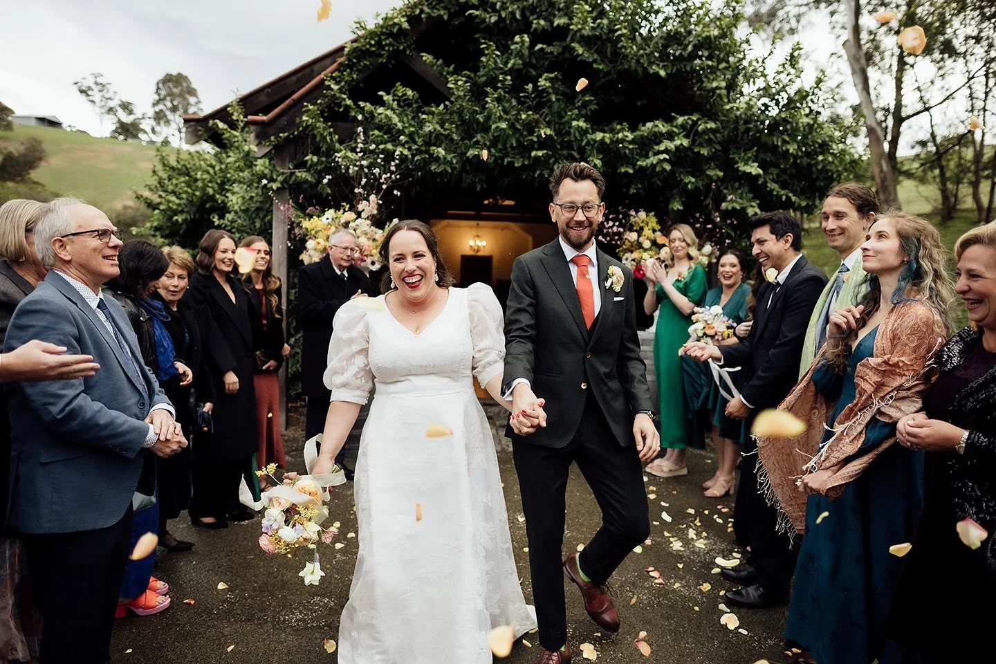 The answer to should you do a petal toss is always YES! Love the post ceremony jubilant shots with petals raining down. 
.
This is joy right here. 
.
And hot tip- just a couple of receptacles full that we can hand out at the last minute. Cones are un