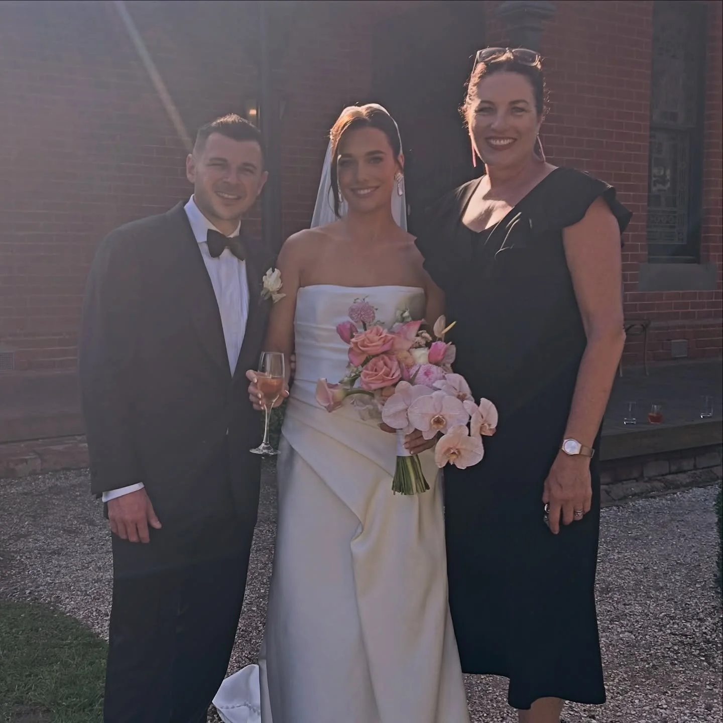 Th shittest photo of two absolute gems with me on their wedding day today. 
.
The sun shone for pre drinks on the lawn, their ceremony amongst the vines and post ceremony cocktails in the courtyard 👌👌.
.
Their ceremony encompassed their meeting in 
