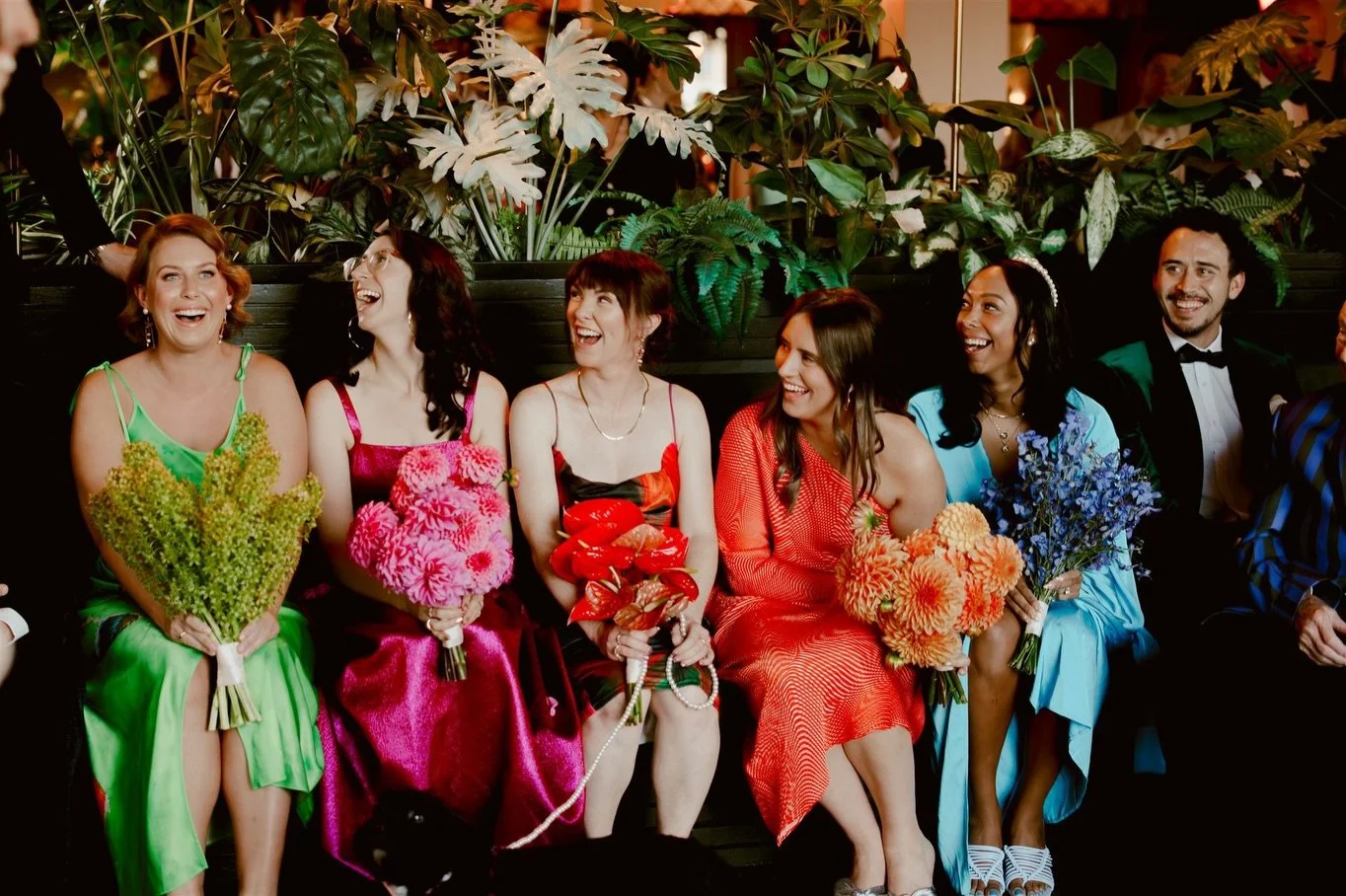 Flanking wedding parties is not the only option!
Stand them to one side together- a little cheer squad for you- or seat them for a great view of you being married. 

I also really love seating families together- a lovely nod to them merging officiall