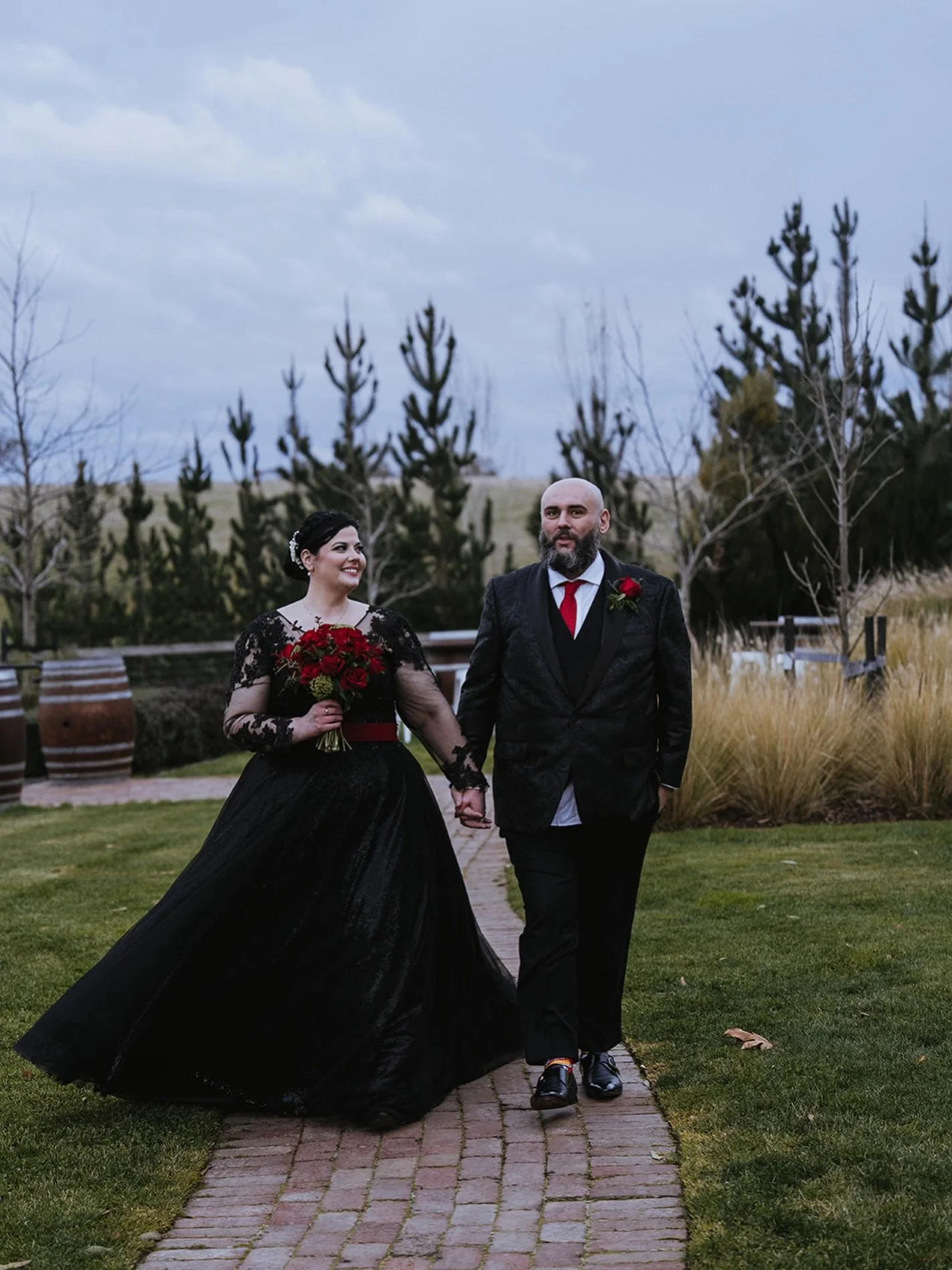 Charlene and Richard made their day completely their own. Starting with their fits. That black dress was incredible!! 
.
A beautiful winter wedding at @warrawongestate, indoors, with the fire blazing. 

Red roses and romance 🥀 &hearts;️ 🥇.
.
.
@dou