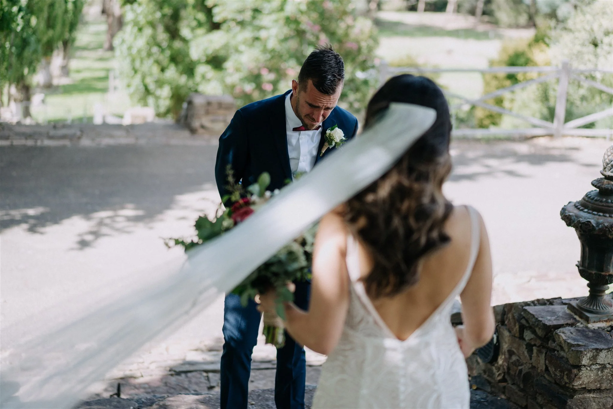 A groom is overcome with emotion when seeing his bride for the first time.