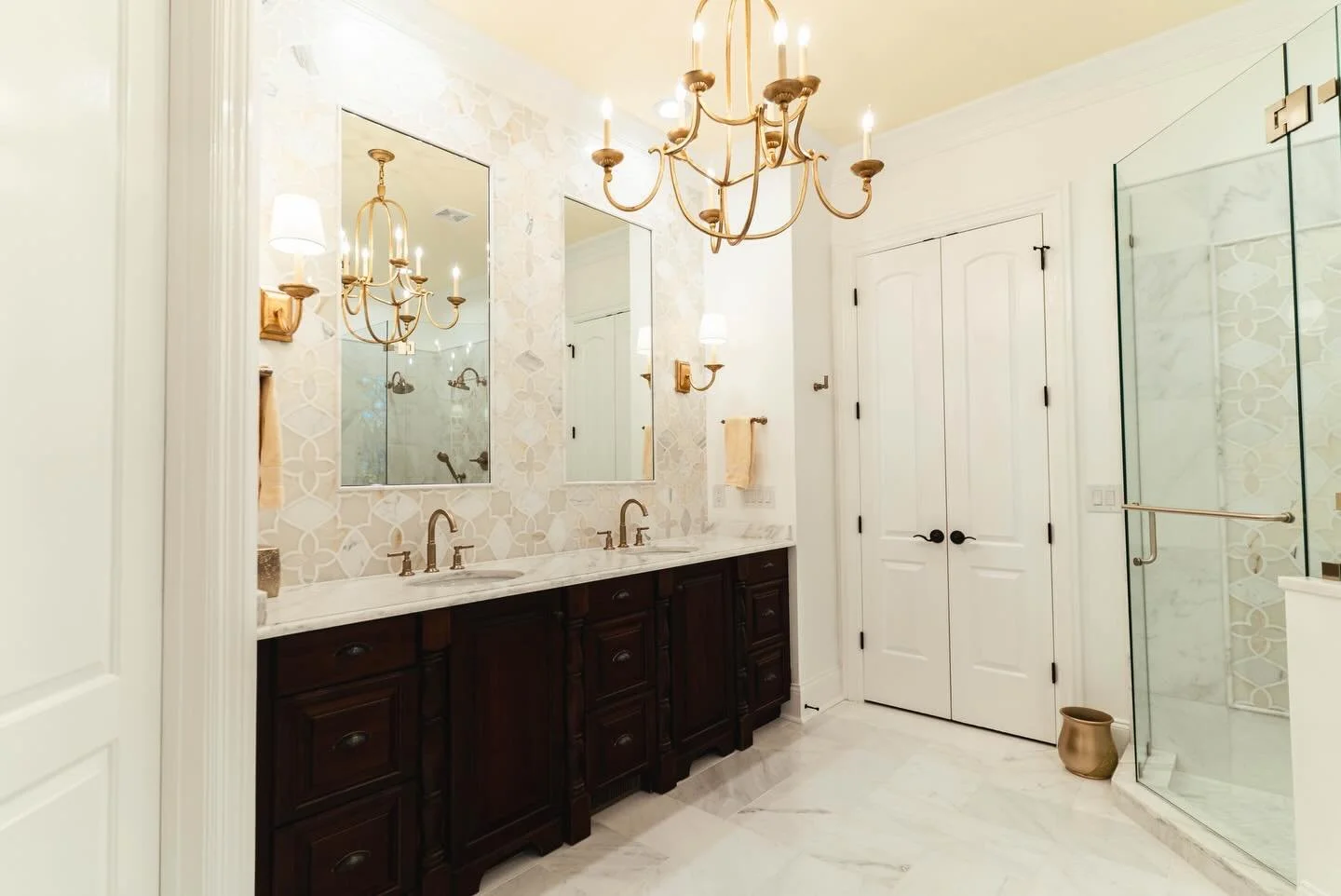 Matthews bathroom renovation that is defined by the details!Gold fixtures, artful tilework, and a statement chandelier designed for both elegance and function🚿💛

#bathroomgoals #homedesign #elegantinteriors #interiorinspo