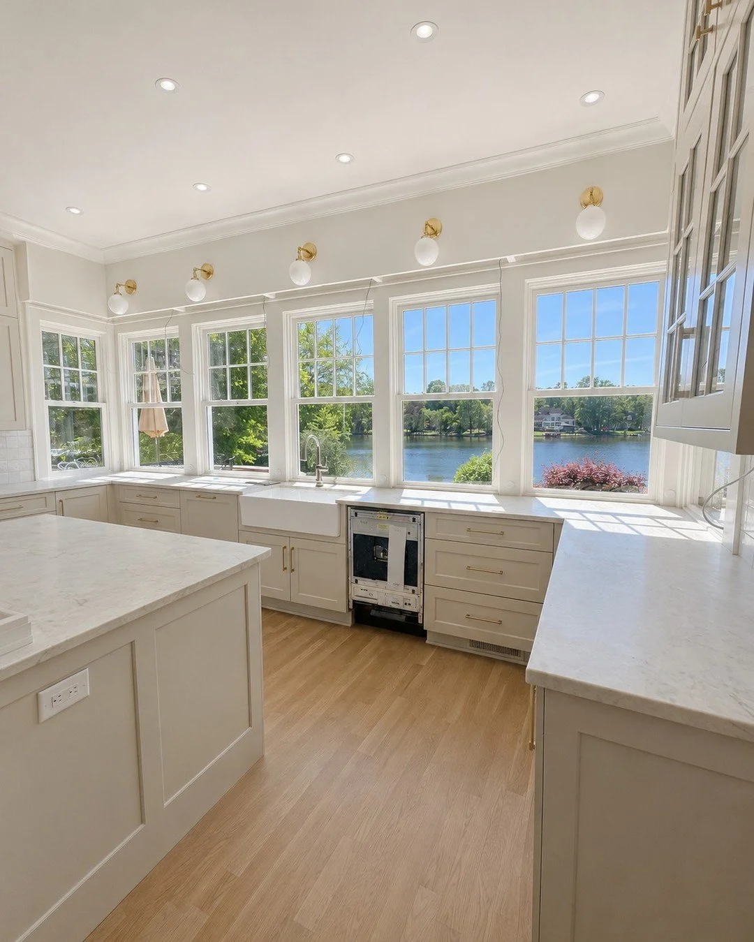 A progress update from South Matthews ✨

This lakeside kitchen is well on its way, with custom cabinetry, beautiful countertops, statement lighting, and wall-to-wall views beginning to come together. While there are still finishing touches ahead, the