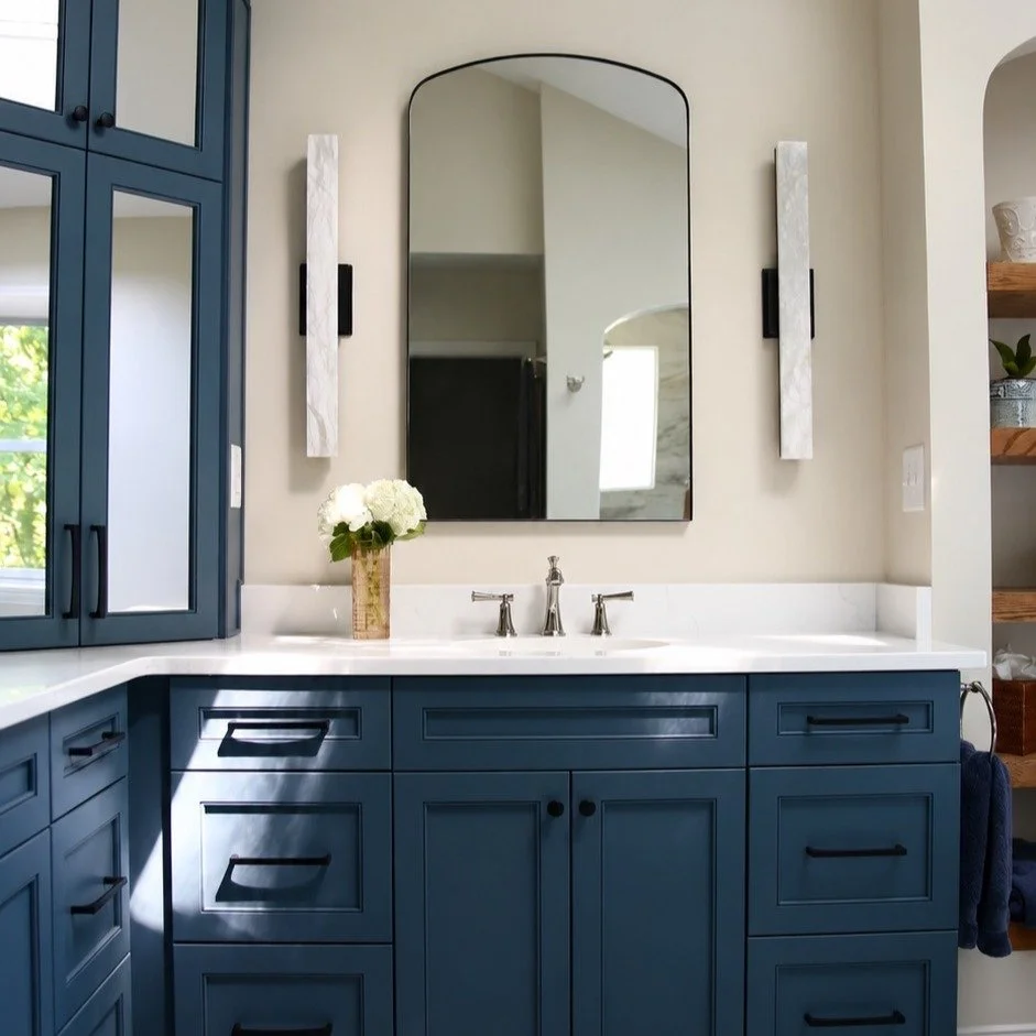 Loving this stunning Matthews bathroom transformation. 

Custom dusk blue cabinetry, polished nickel fixtures, and sleek quartz countertops come together to give this space a fresh new feel. 

@fergusonhomeofficial @sitelinecabinetry @topknobs @msi_c