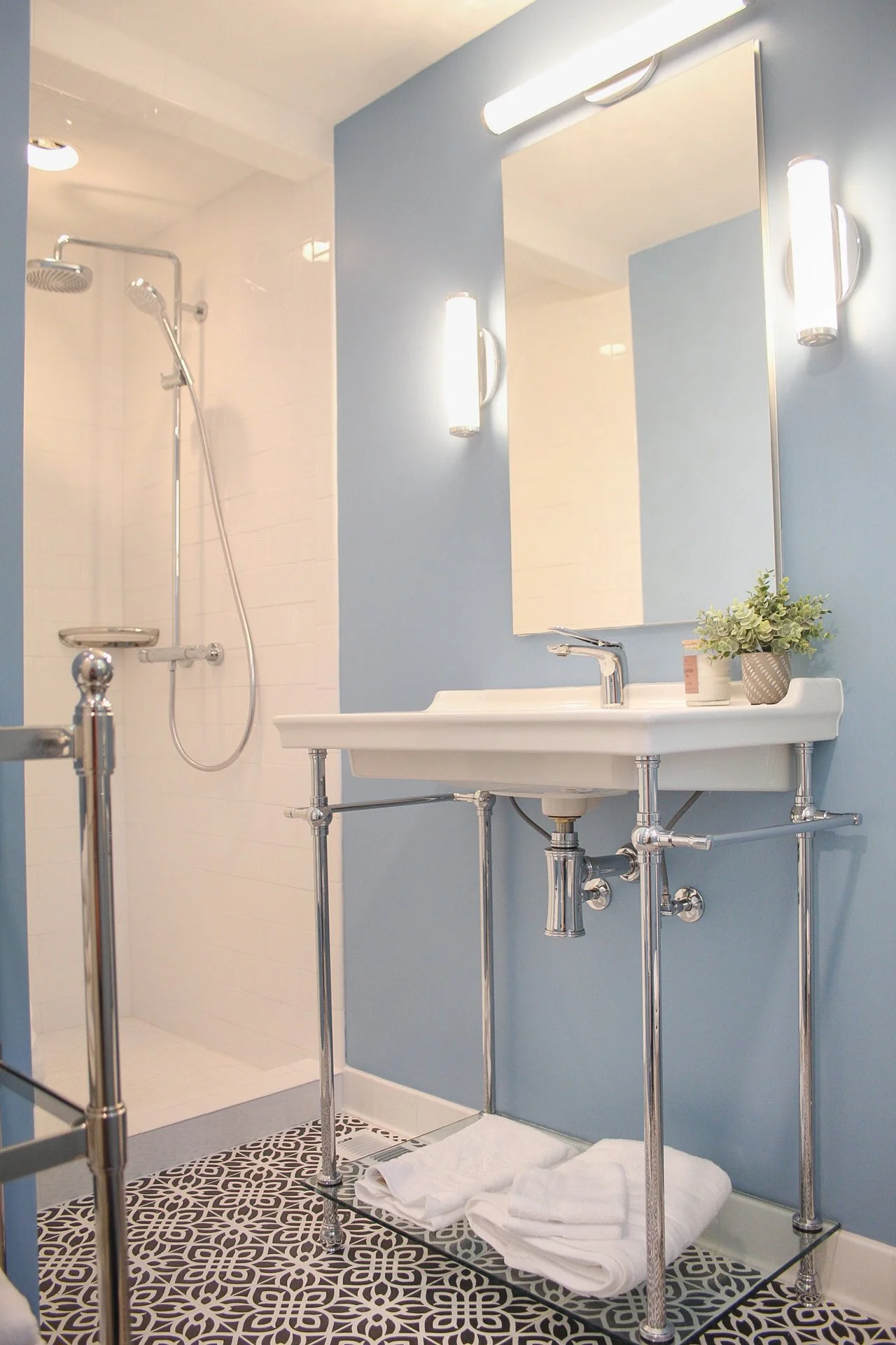 Providence Plantation Renovation with warm lighting, blue walls, and beautifully crafted tile floors.