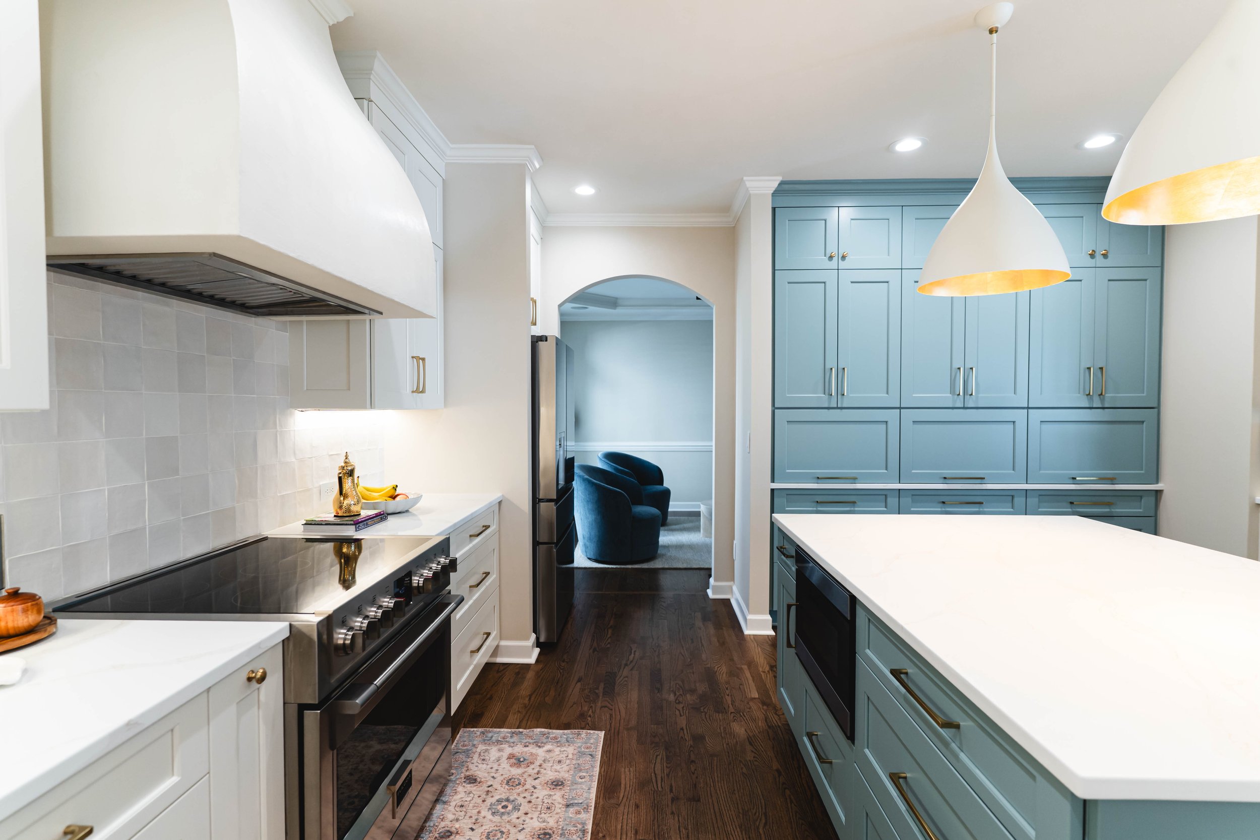 Soft Arched Opening and Hood Lighting adds character to this Matthews kitchen renovation. 