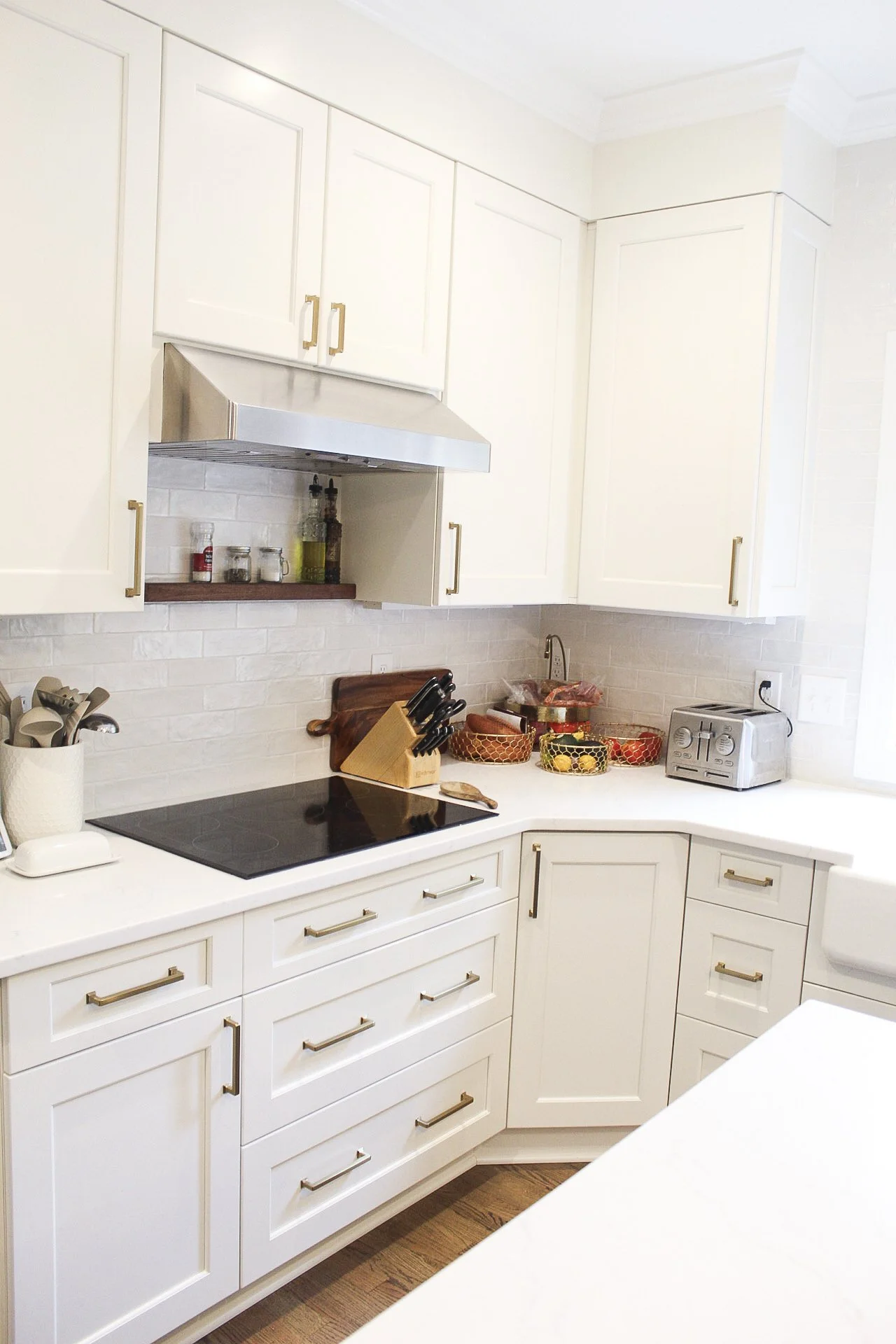 South Park Kitchen Renovation Featuring custom cabinetry, durable quartz countertops, tile backsplash, and thoughtfully chosen brass hardware.