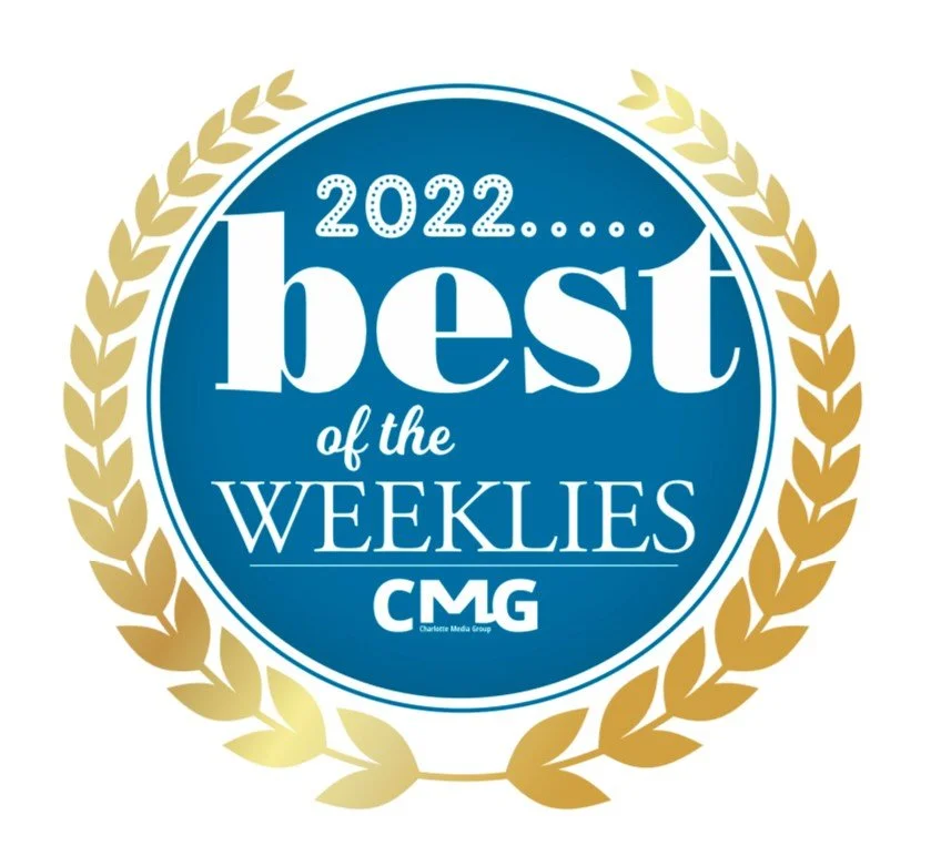 A circular award badge with a gold laurel wreath border, blue background, and white text that reads '2022 best of the Weeklies CMG Charlotte Media Group.'