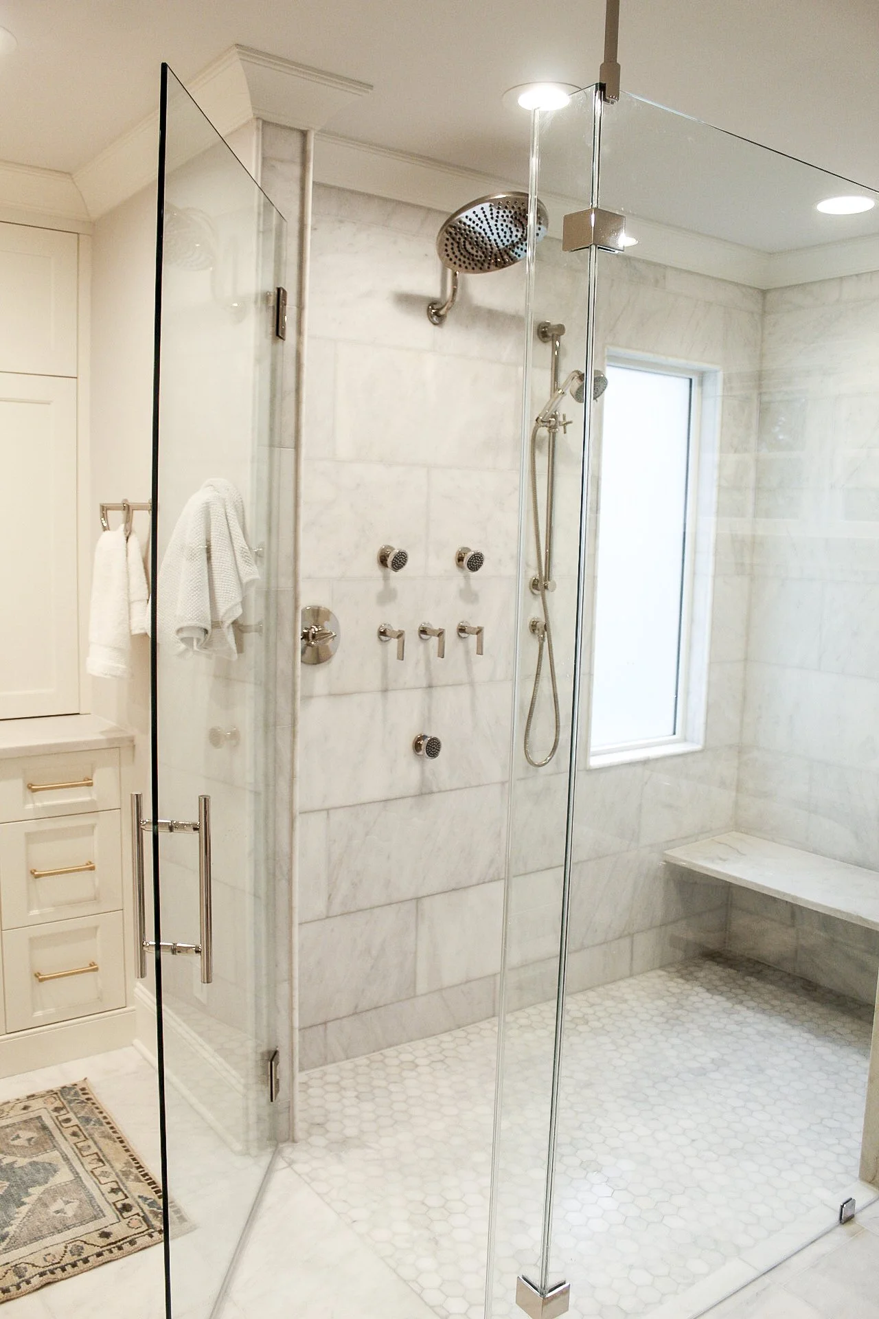 South Charlotte Bathroom Renovation Showcases a luxurious shower system and beautiful custom tile work. 