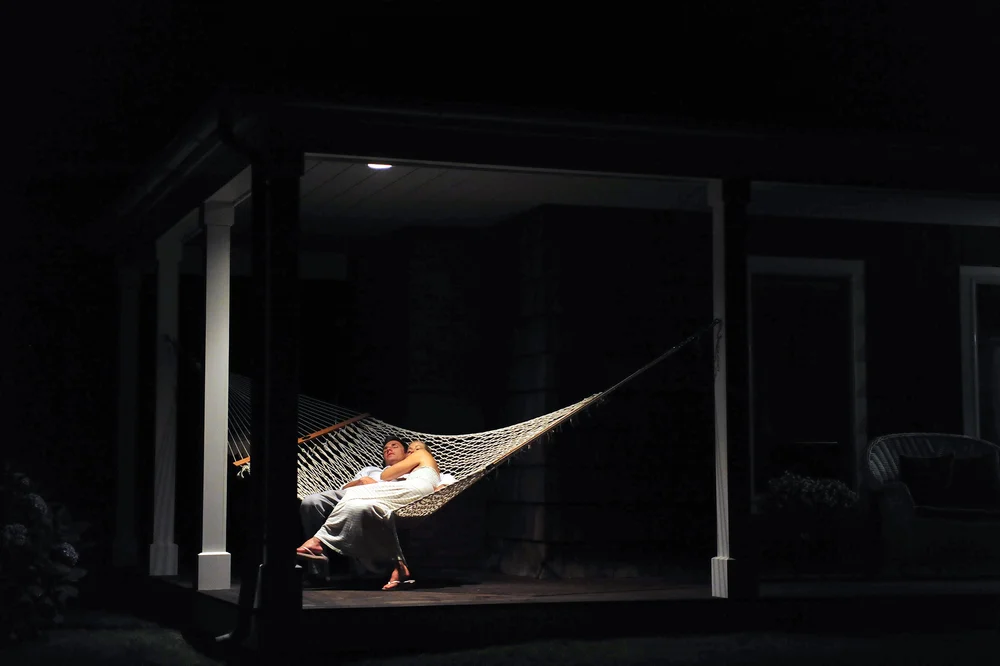 Long Island wedding photo of a bride and groom on a hammock. 