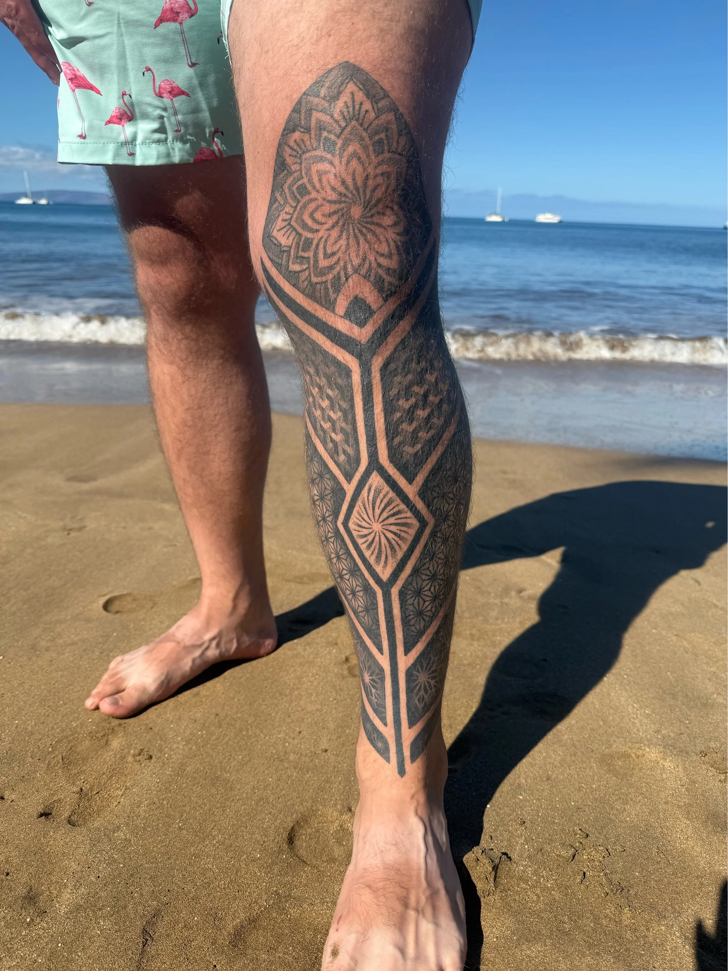 Sacred geometry leg sleeve tattoo with dotwork and bold lines, designed and tattooed by Maya Wild at Sub Rosa Tattoo Studio in Grants Pass, Oregon. This intricate piece highlights symmetry and complex details. Ideal for clients looking for masculine,