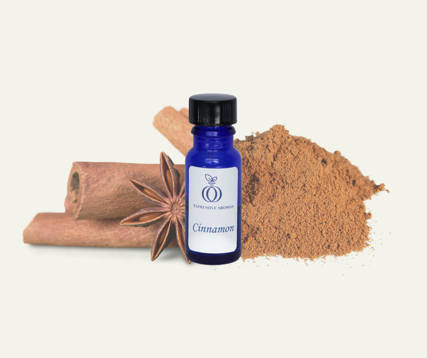 A small blue bottle labeled 'Cinnamon' from Expressive Aromas, surrounded by cinnamon sticks, a star anise, and ground cinnamon on a white background.