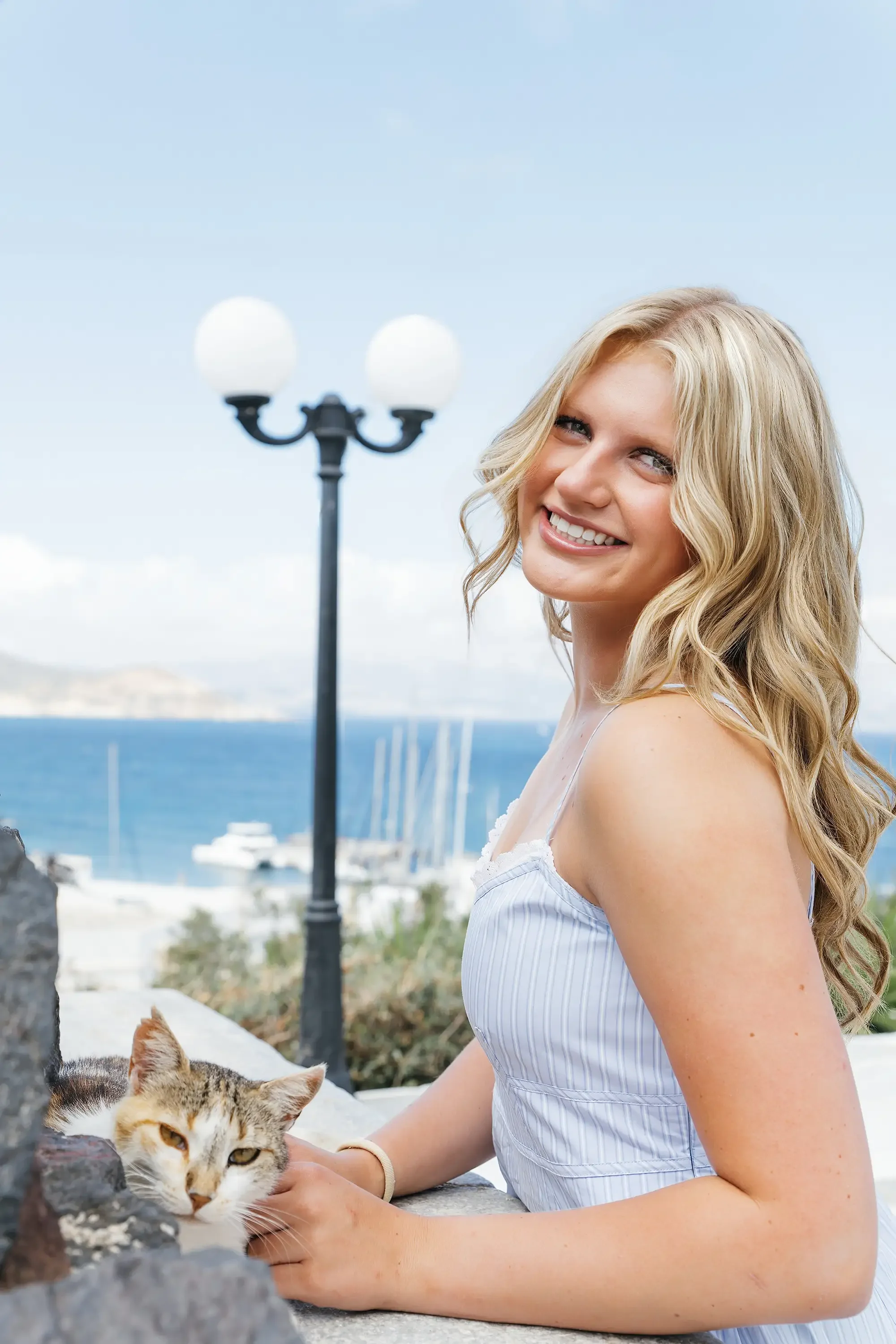Natural vacation portrait in Naxos, Greece, captured by Naxos Photographer in Naxos Old Town with the Aegean Sea and island scenery in the background.