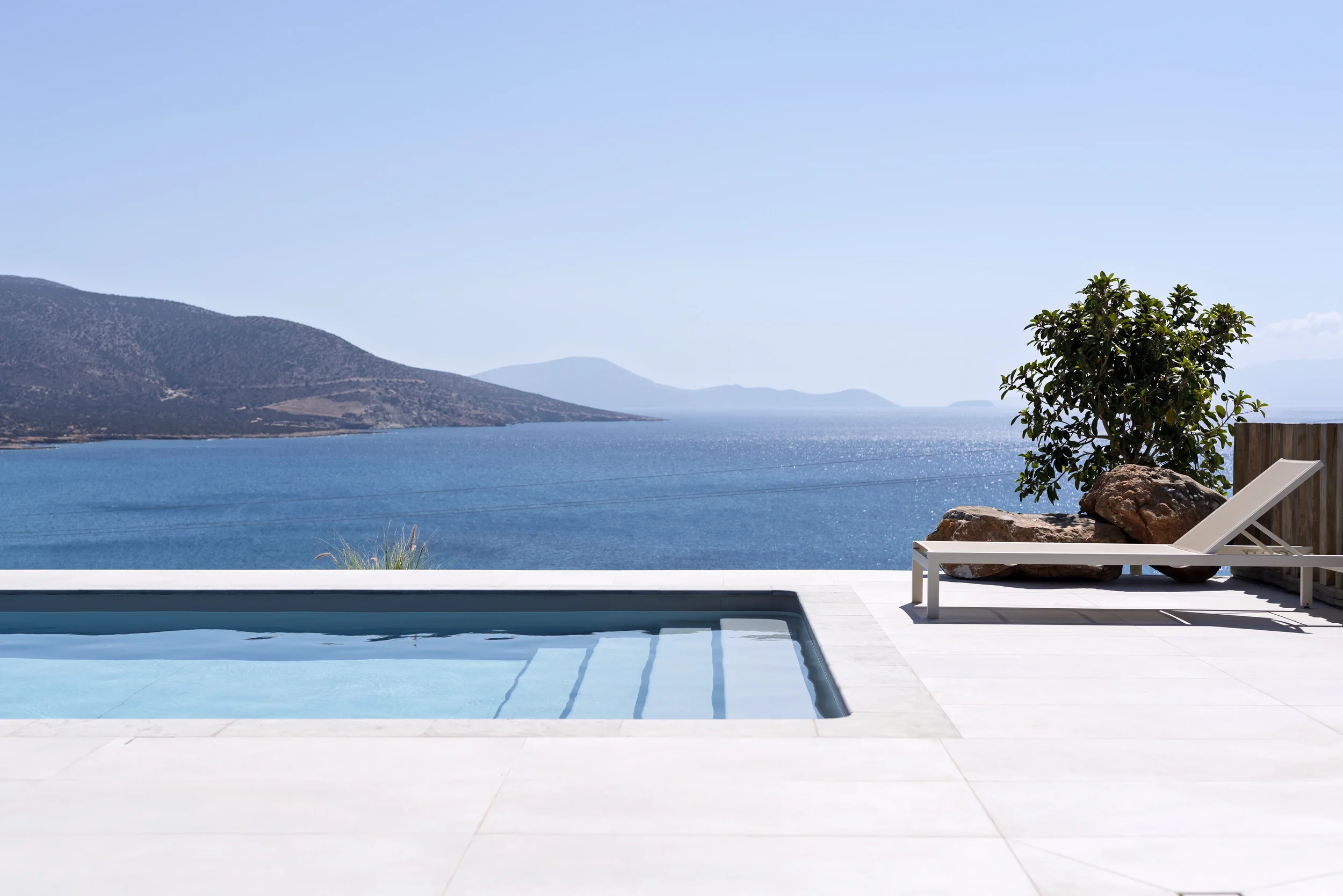 Luxury villa infinity pool overlooking the Aegean Sea and mountains — real estate photographer Naxos Greece