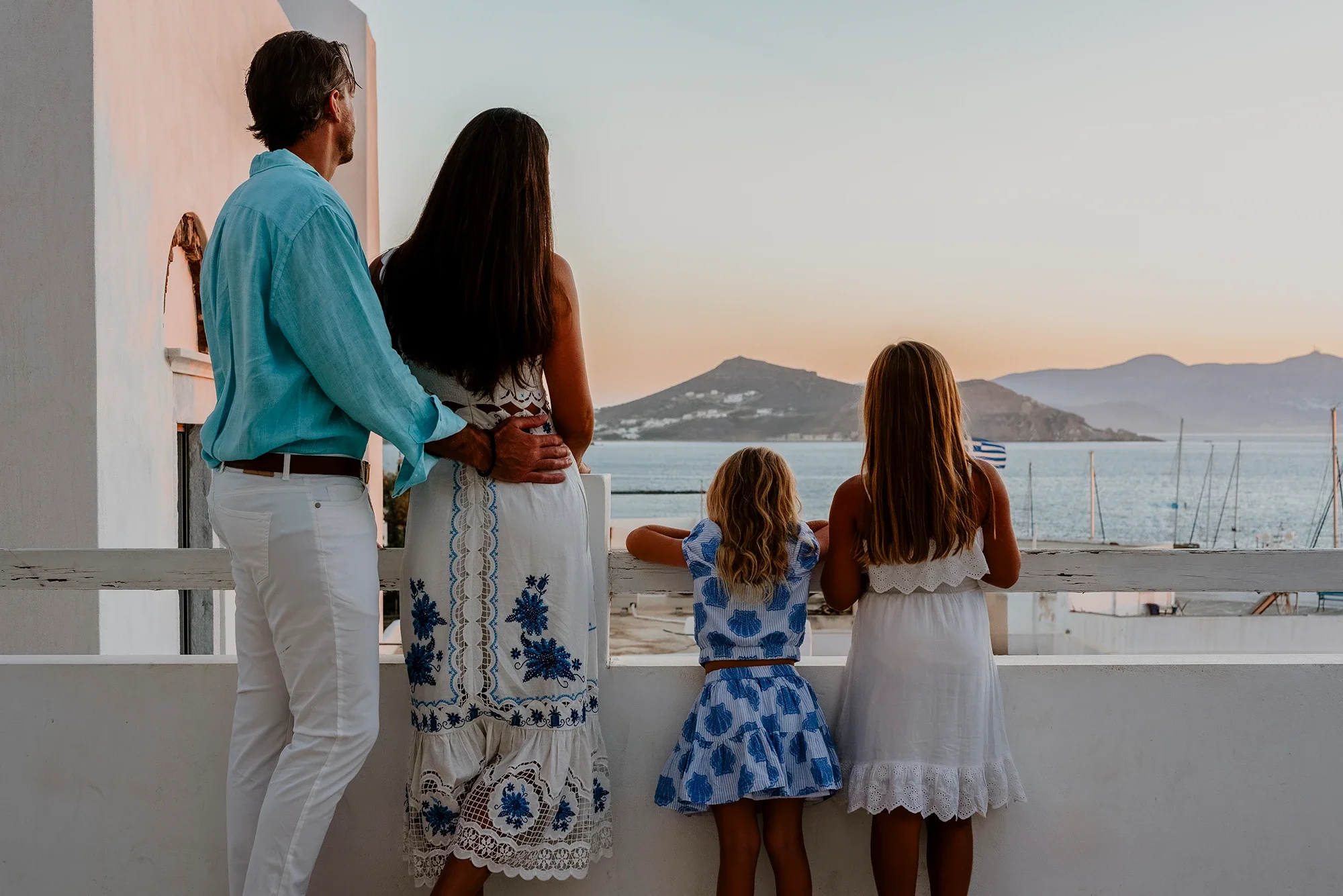 watching the sunset from a balcony in Naxos with sea and mountain views